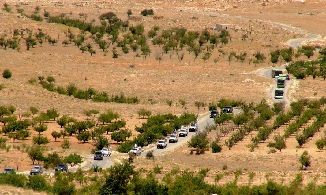 Vehicles make their way through Lebanon as part of the repatriation of Syrian refugees in August 2017. Photograph: Anadolu Agency/Getty Images/The Guardian