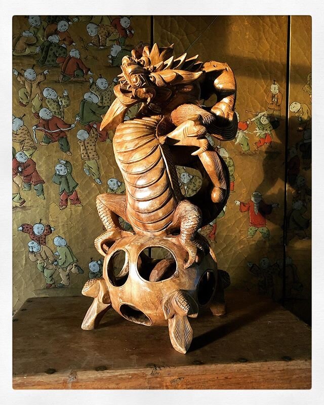 1800&rsquo;s Carved Teak Dragon Sculpture... this gorgeously detailed dragon is carved from 1 solid piece of wood.
There&rsquo;s a carved wooden ball loose inside the round section the dragon stands on, that you can&rsquo;t see right now... think abo