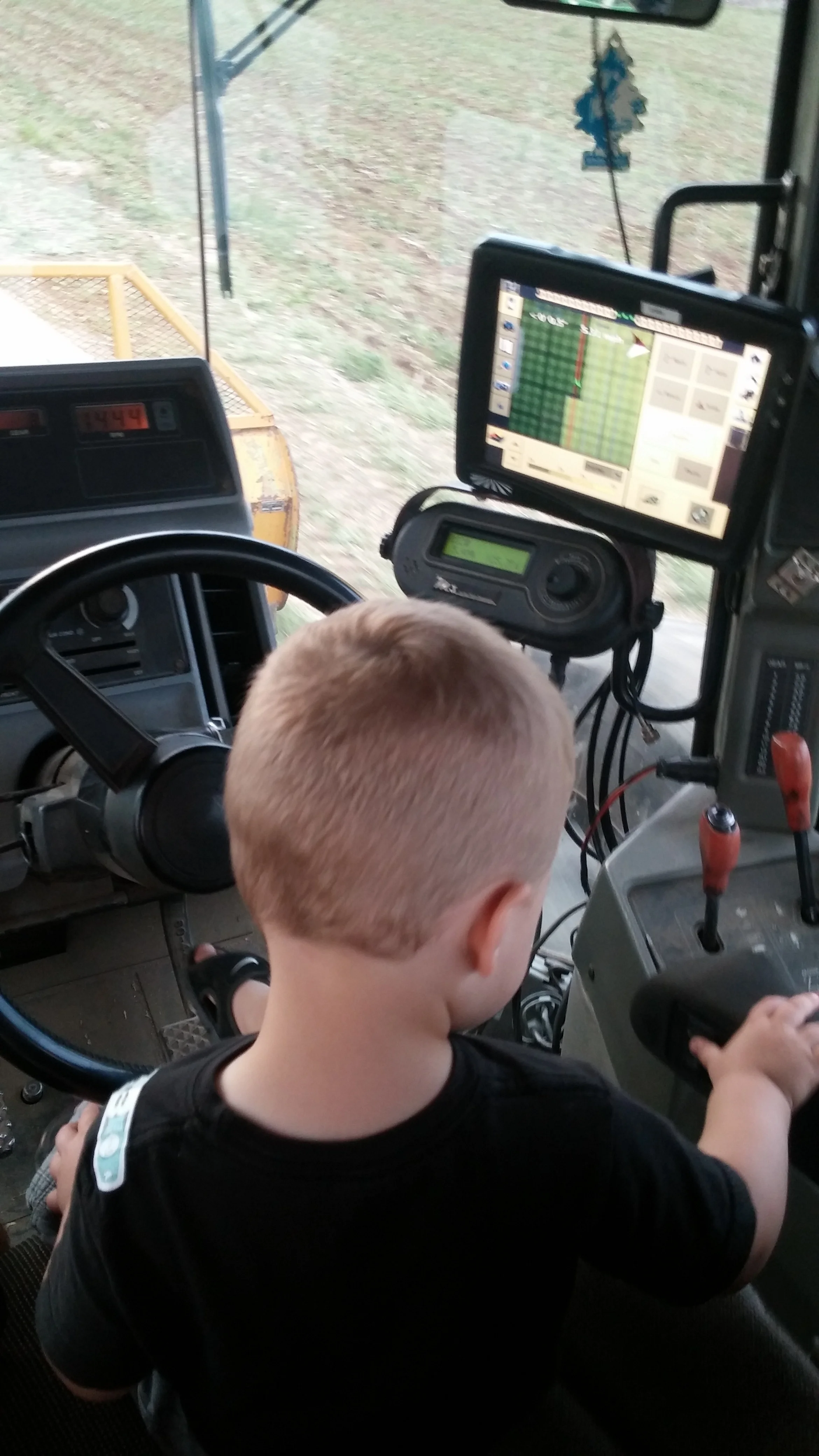 Austin running the drill planting cover crop after lima beans 2016
