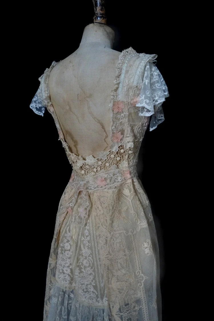 Warm coloured vintage and antique lace wedding dress.  jane bourvis