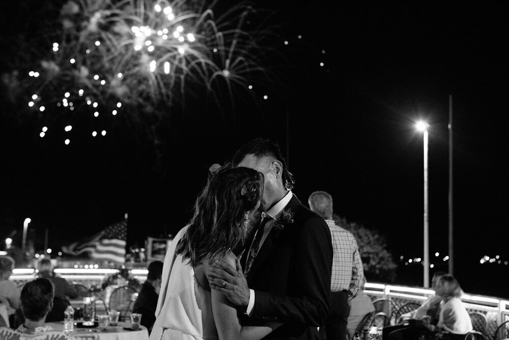 bride-and-groom-kiss-under-fireworks.jpg