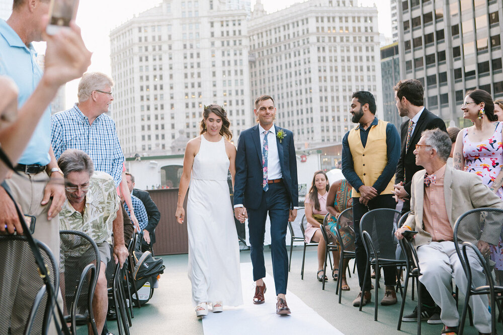 bride-and-groom-walking-down-aisle-downtown-chicago.jpg