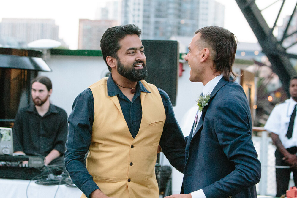 groom-and-friend-chatting-chicagos-leading-lady.jpg