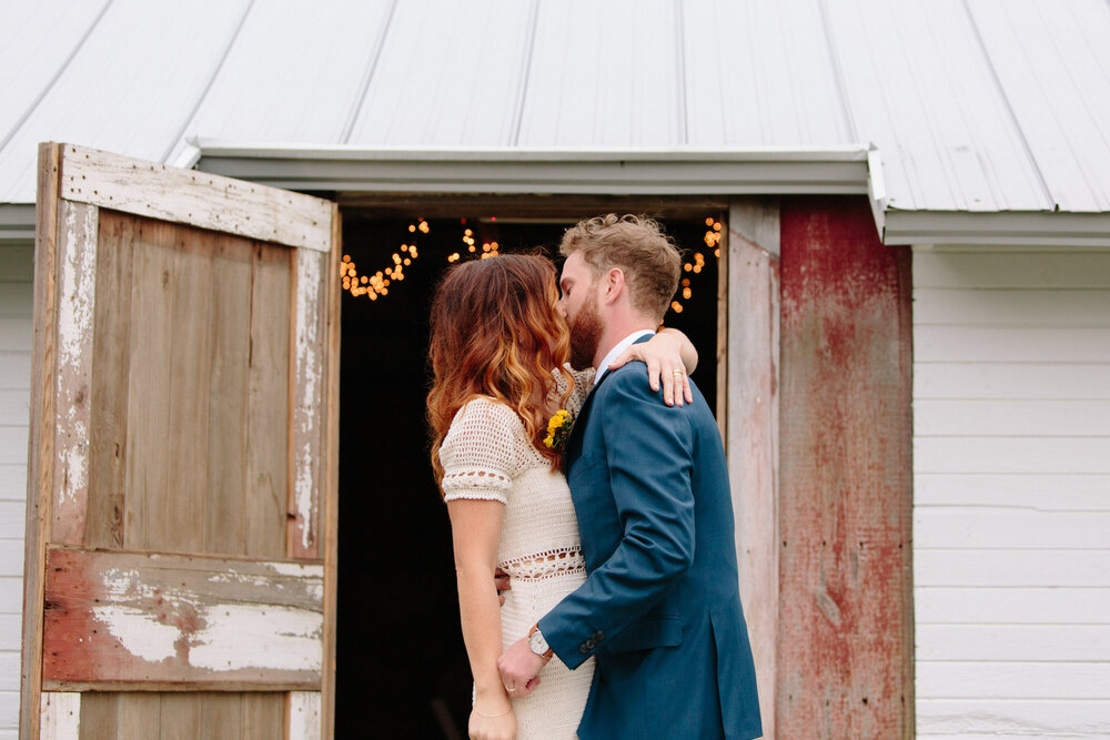 bride-and-groom-kiss-heritage-prairie-farm-wedding.jpg