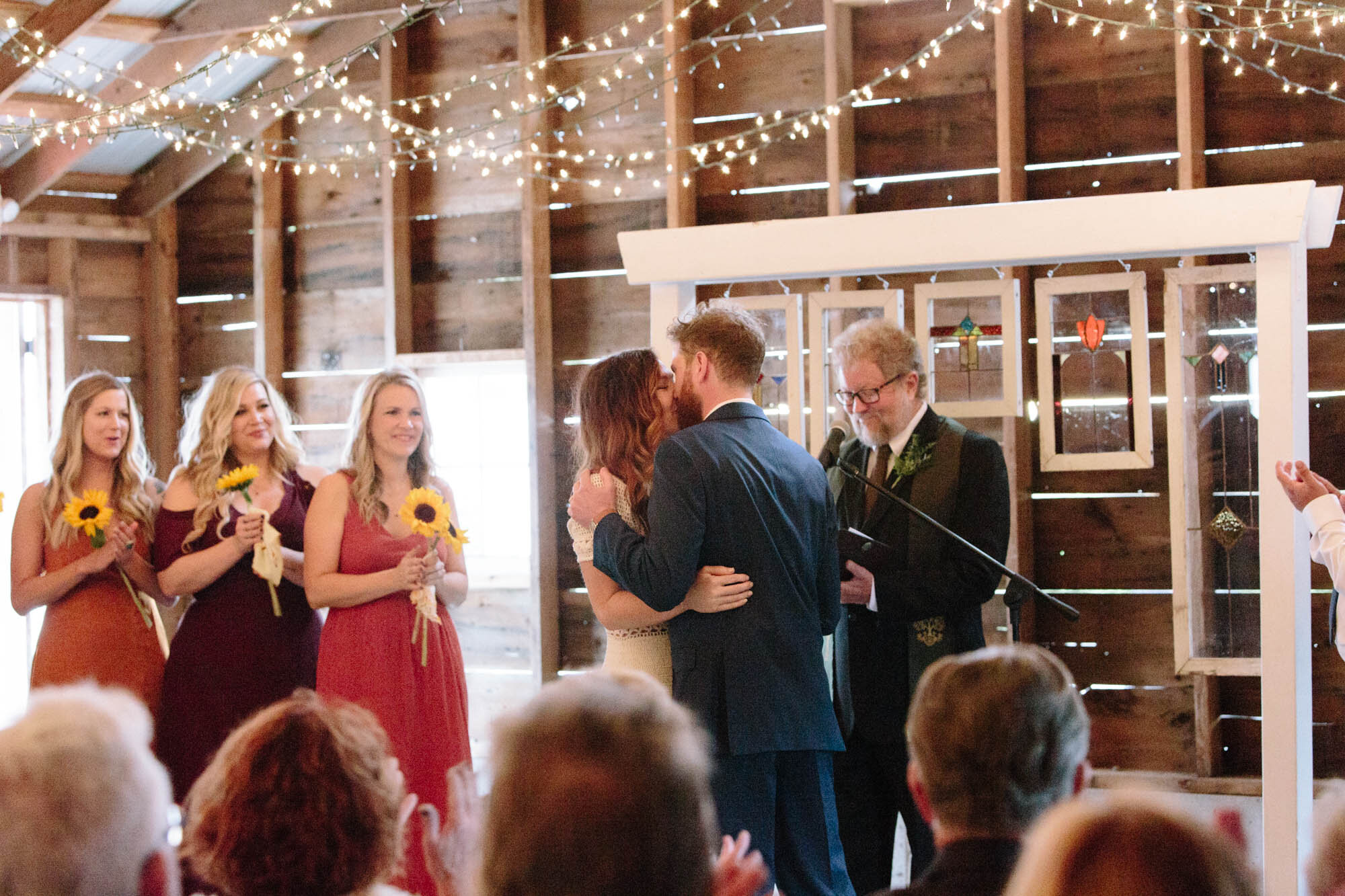 first-kiss-at-heritage-prairie-farm-wedding.jpg