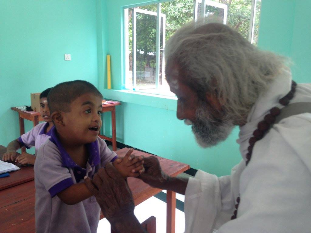 Our beloved Mr. Kaliyugavarathan (Swamiji) meeting one of the children with special needs.
