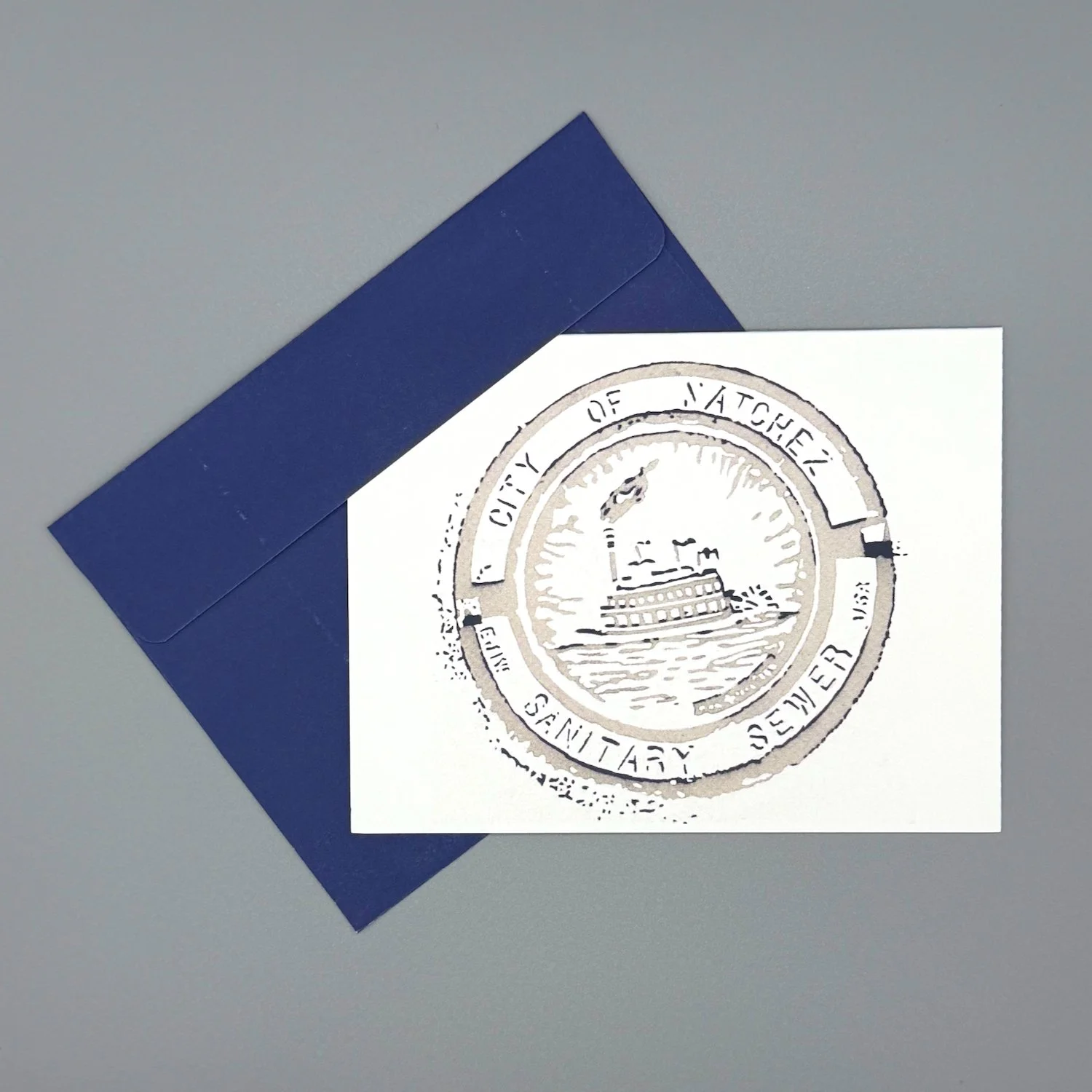 merch-manhole2-notecard-envelope-navy.jpeg