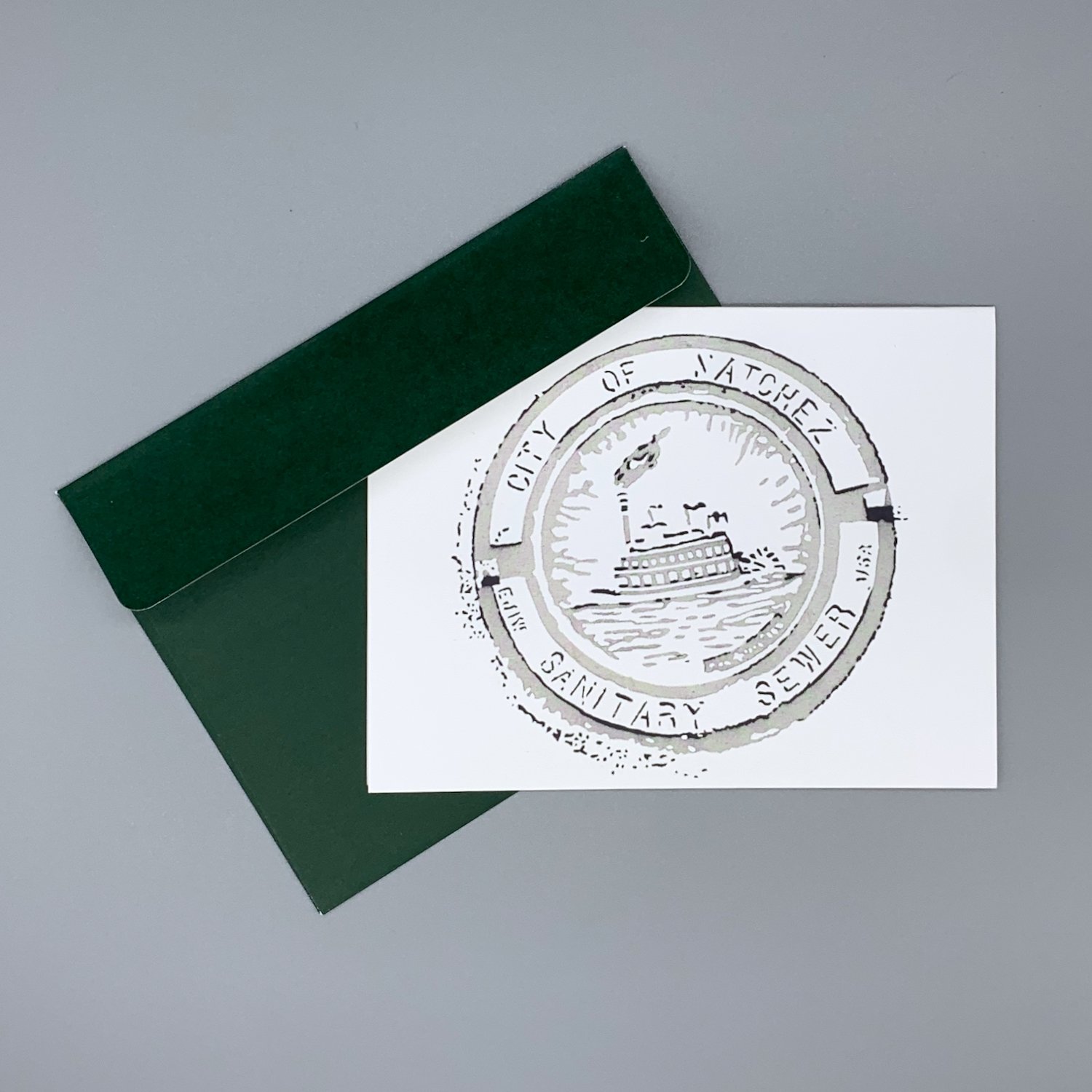 merch-manhole2-notecard-envelope-evergreen.jpeg