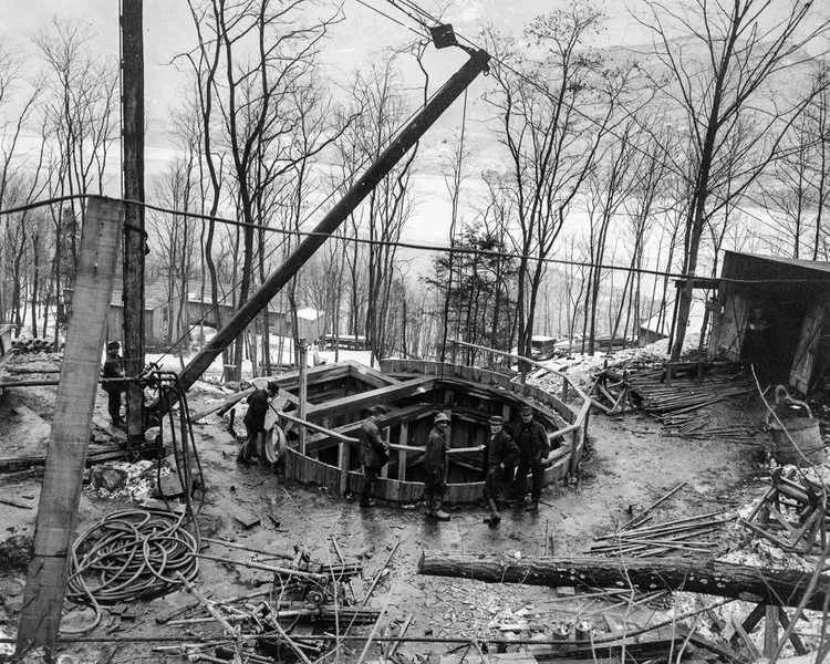 The top of Shaft 7 of the Moodna pressure tunnel, with the Hudson River in the background, New York, 1910.