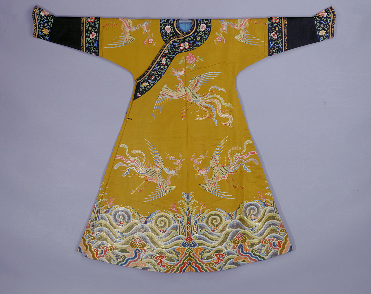 Empress' Champagne-Colored Auspicious Robe with Flower and Phoenix Motifs Qianlong reign (1736-1795), Qing Dynasty (1644-1911) The Palace Museum Collection