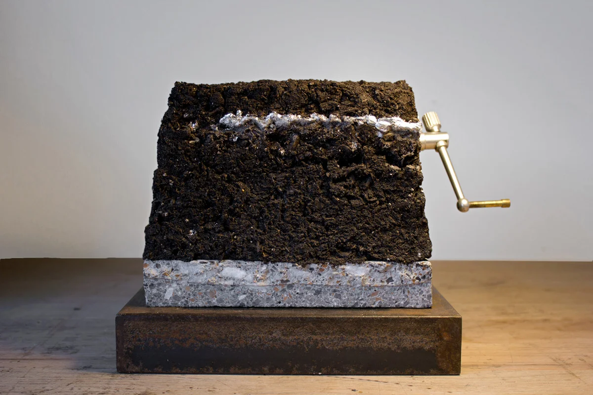   Blocks [#6] 
 Mechanical sculpture with soil, granite slab, nickel, motor, brass crank, steel base. 
 6 x 7 x 6 in 
 2014 
 View video  documentation  
 &nbsp;  