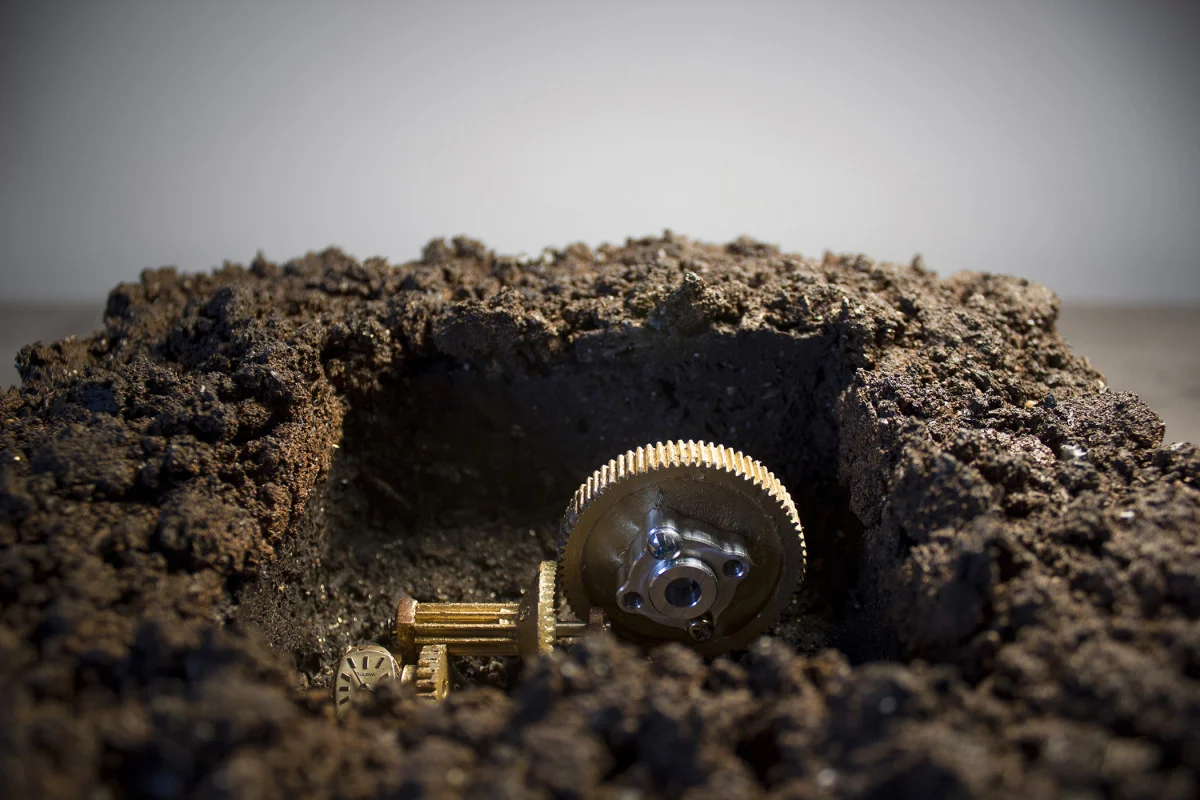     Blocks [Lost/Gained, I Want What's Yours]  -  detail Mechanical sculpture with soil, volcanic rock, granite slab, motor, gears, gold leaf, gold watch 10 x 8 x 8 in 2014, view documentation:  https://vimeo.com/84714384   