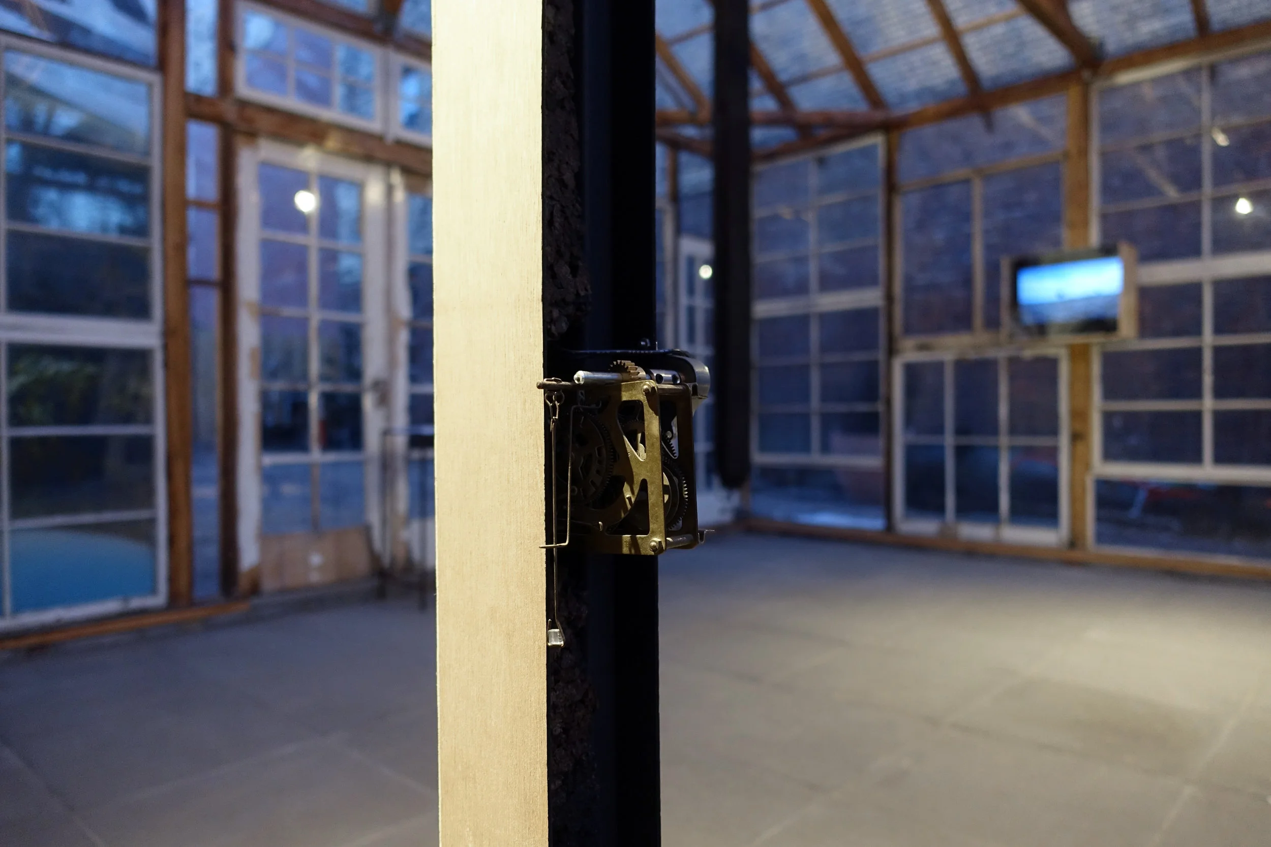  Timepiece #1, #2 and #3 (Installation view) Three-part mechanized sculpture "clocks"&nbsp;with wood, dirt, gears, motor, brass and mirrors 96 x 3 x 3 in 2016 