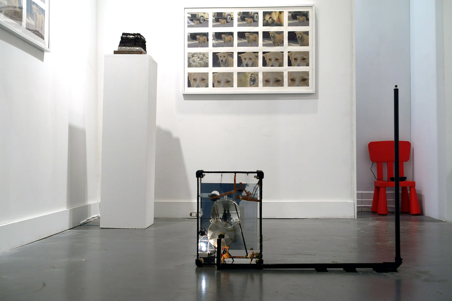   Not Going Anywhere  Mechanical sculpture &amp; interactive video installation built into acrylic casing. Components include a live camera, LCD, repurposed parts from a piano and a typewriter, Zoetrope built from microwave parts and drawings, insula