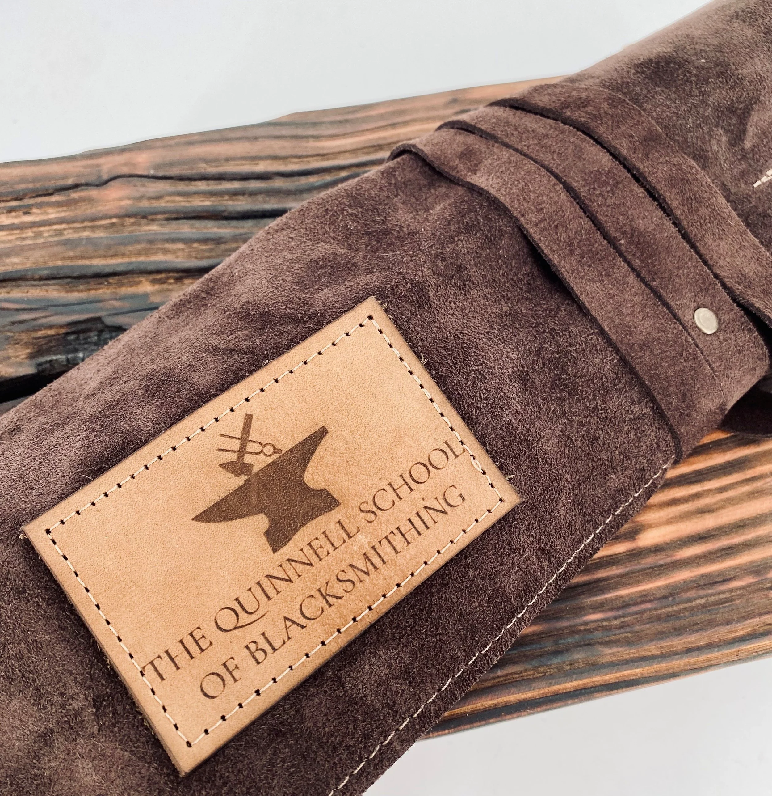 The Quinnell School of Blacksmithing Leather Logo.jpg