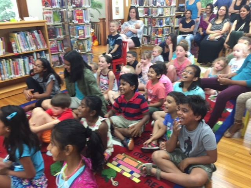 The kids at Crosswicks Library watching Dr. Zing-Zong.