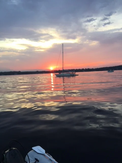  Quiet evening at anchor off Valcour Island , Bluff Cove North looking west to New York State. 