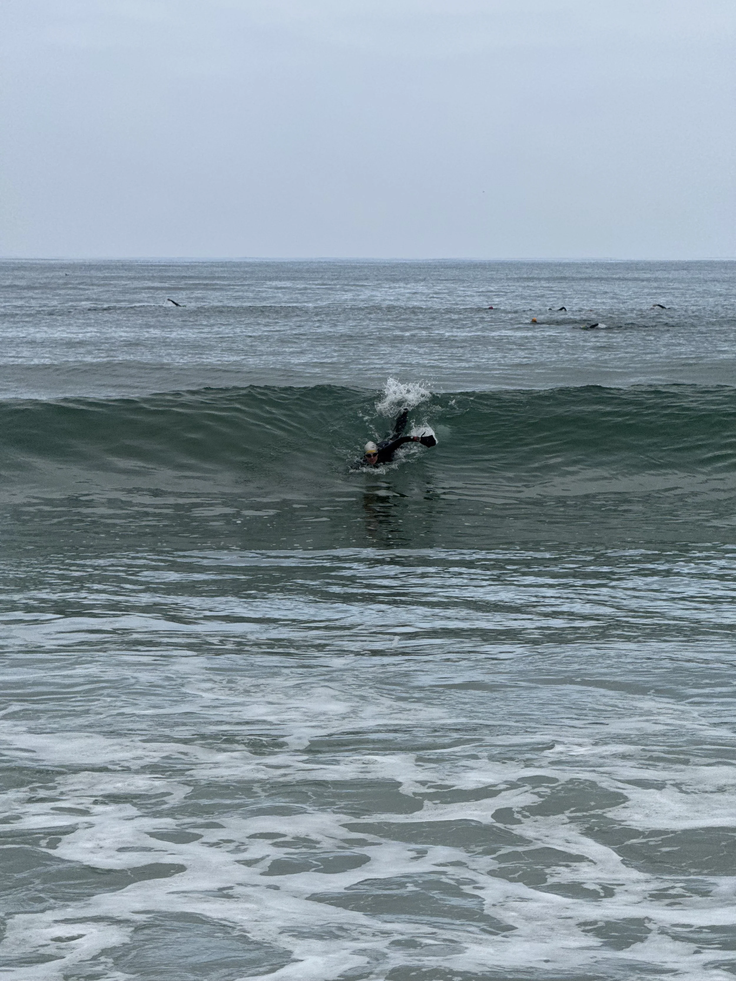 Me swimming in an ocean wave.