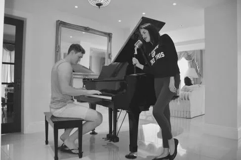 Planning the shot around the grand piano.