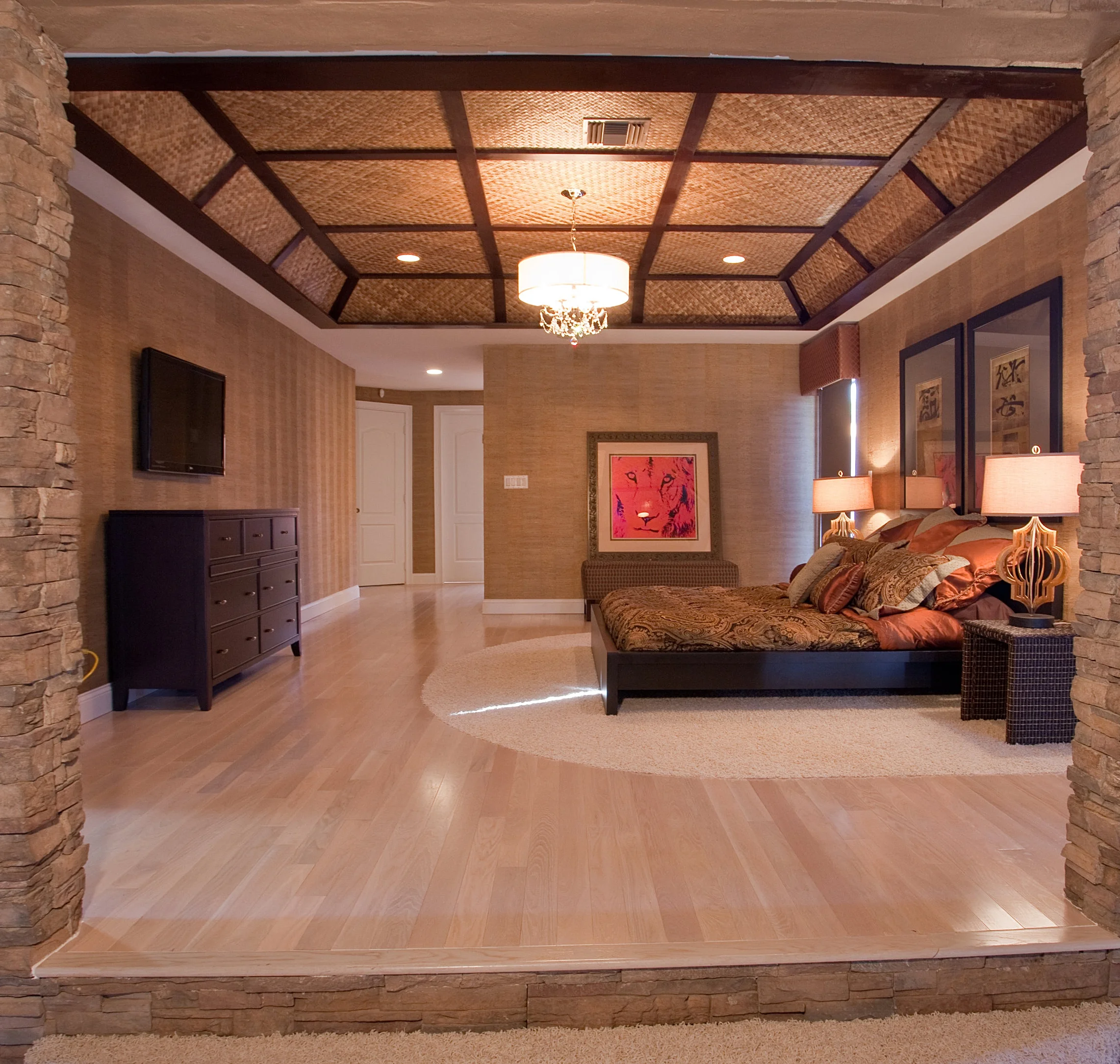 The Master bedroom was created by host and licensed contractor by Rob Van Winkle (also know as Vanilla Ice) for his DIY Network’s original series The Vanilla Ice Project. Rob decided to expand the room by tearing down the far wall that had extensive water damage and add a Florida room to make the space bigger and brighter. Using SIW Impact windows and doors and RollTech self powered blinds, Rob created this room to let the light in or out while keeping Mother Nature safely outside. With plush carpet by Shaw and fine hardwood floors from Lumber Liquidators that goes perfectly with the hand woven bamboo ceiling application that Rob created. The Havertys bedroom furniture is a perfect match for the chandelier form the Vanilla Ice lighting collection from Capital Lighting. (interior)