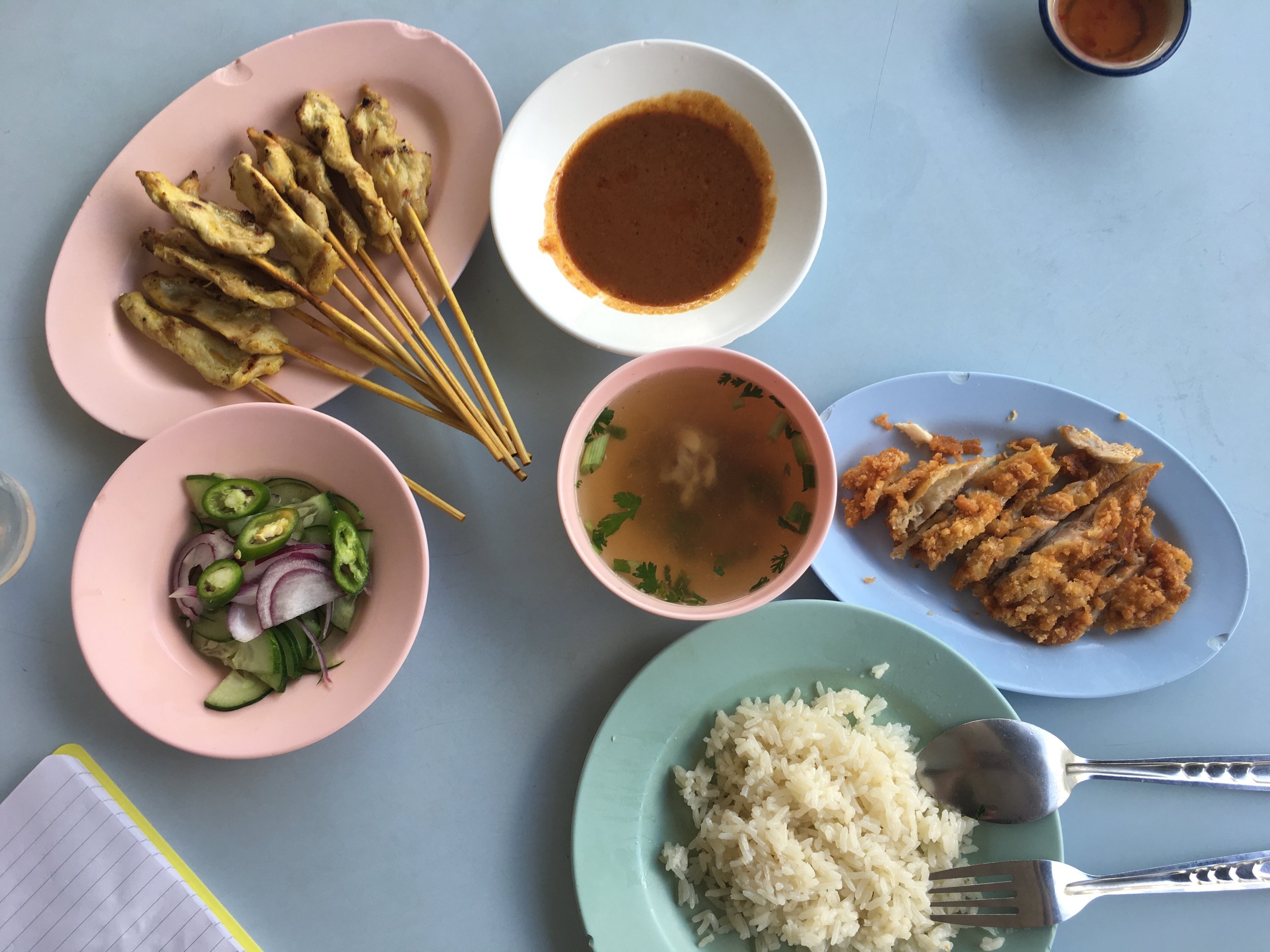 Pork satay, crispy chicken with sweet chilli sauce, steamed rice, chicken/pork broth & pickled cucumber salad