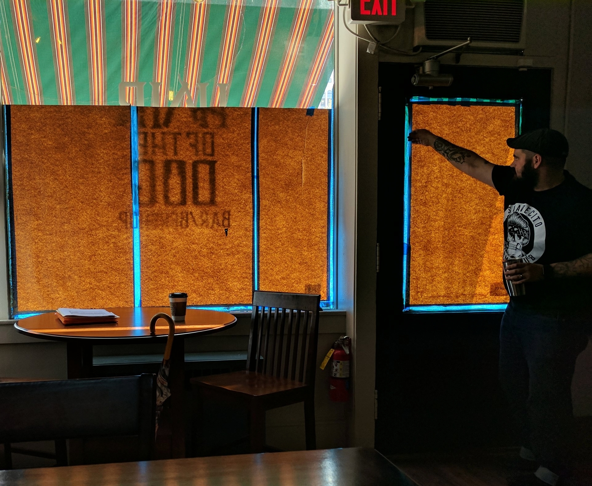 Pulling the paper off the windows...
