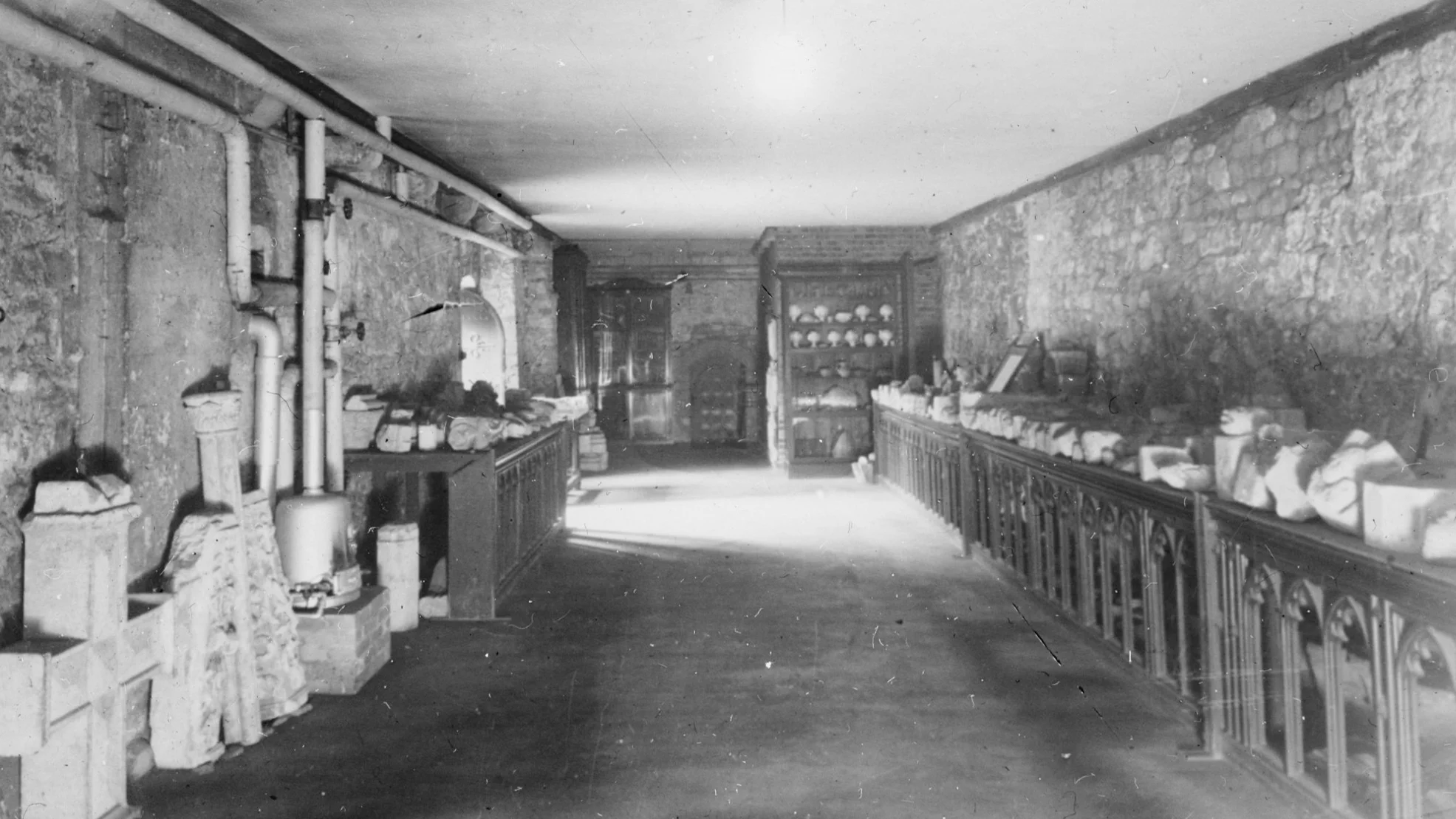 Figure 5. Photograph c.1900 of the stone fragment collection established by George Payne, F.S.A. in the Slype.