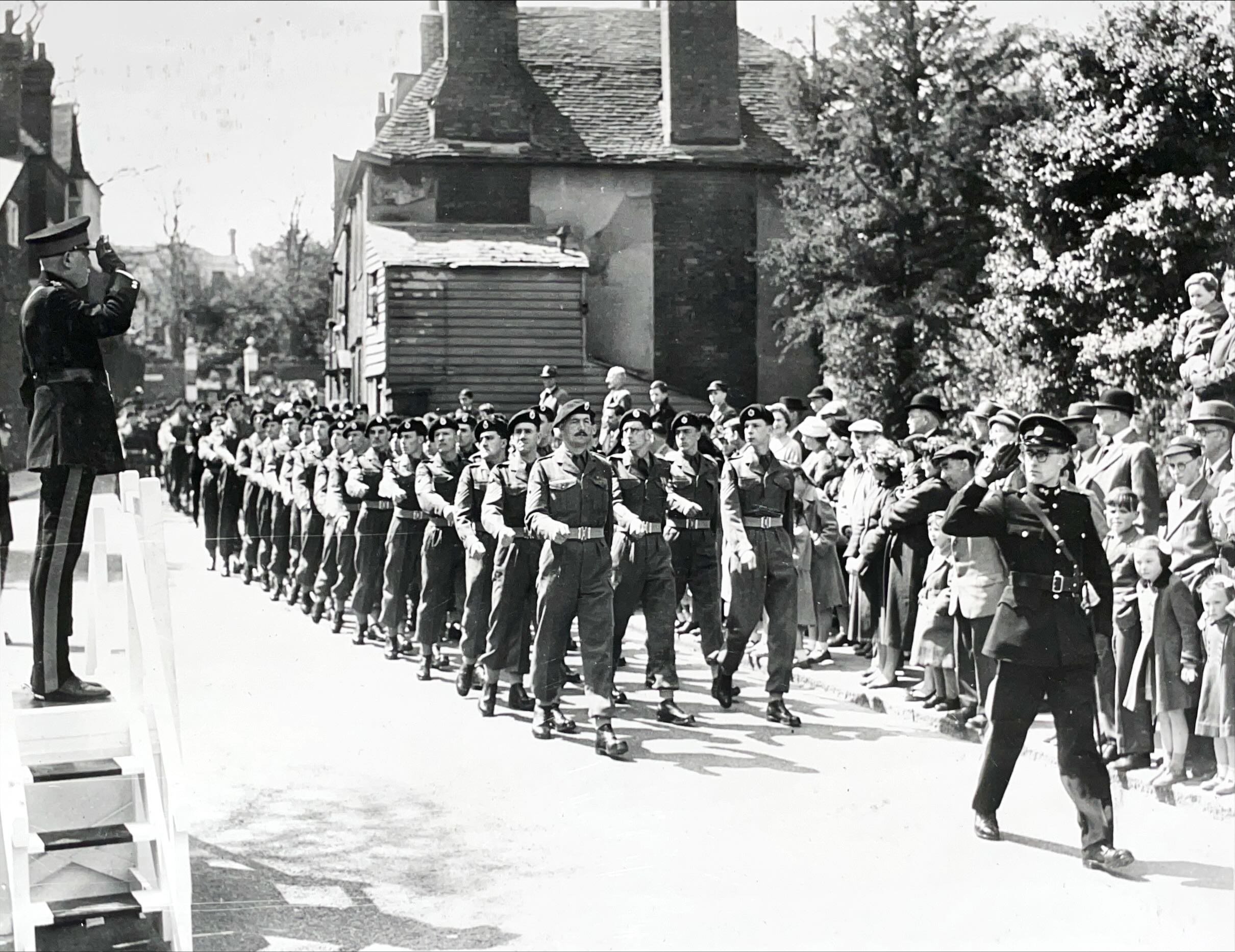 Members of the RE Association march past after service, May 1957