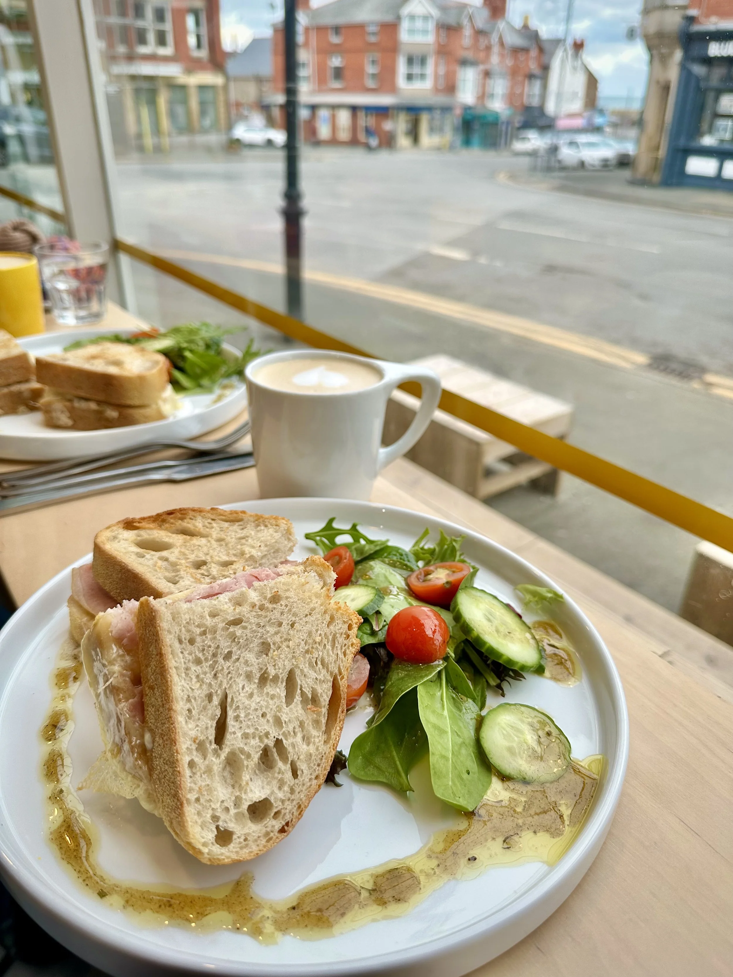 A sandwich and salad on a plate in a cafe in Rhos, North Wales