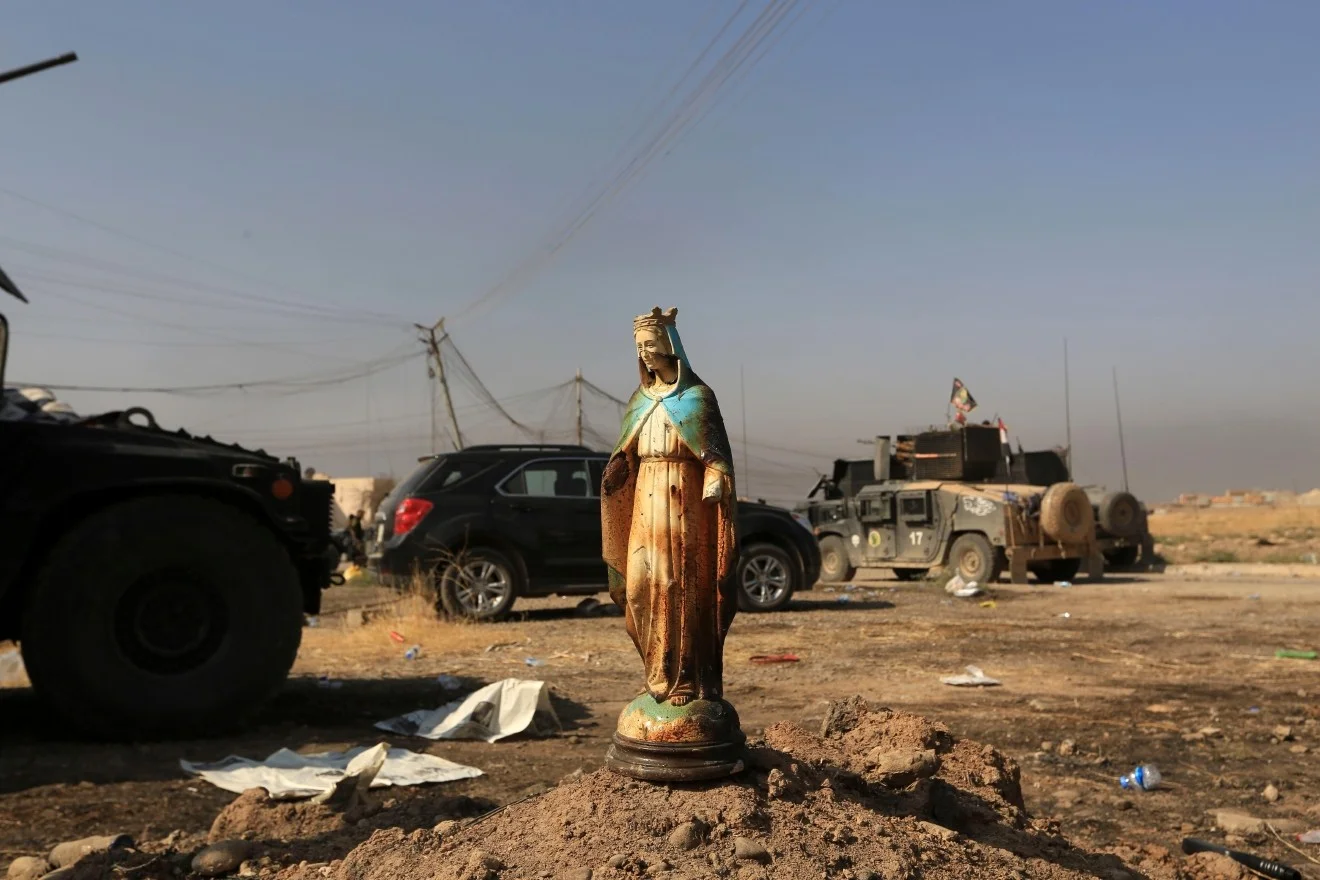 A statue of Virgin Mary is placed in a street in Bartella, Iraq, Sunday, October 23, 2016. Iraqi forces captured Bartella, around nine miles east of Mosul. Photo by AP Photo/Khalid Mohammed.
