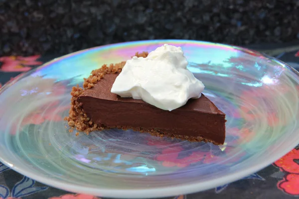 Vegan Chocolate Pudding Pecan Pie Author: Dédé Wilson Makes: Serves 8 Ingredients 1, Pecan Pat-In Crust , baked and cooled 1 recipe Chocolate Almond Milk Pudding 1 recipe Vegan Coconut Whipped Cream Instructions Have the crust baked and cooled. Prepare the pudding as directed and scrape it into the prepared crust. Chill until firm, at least 4 hours. You may hold the pie overnight in the refrigerator. Prepare Vegan Coconut Whipped Cream right before serving and dollop a generous amount on top of the whole pie, or top each slice as you serve it. Pie is best served chilled. Image: Dédé Wilson