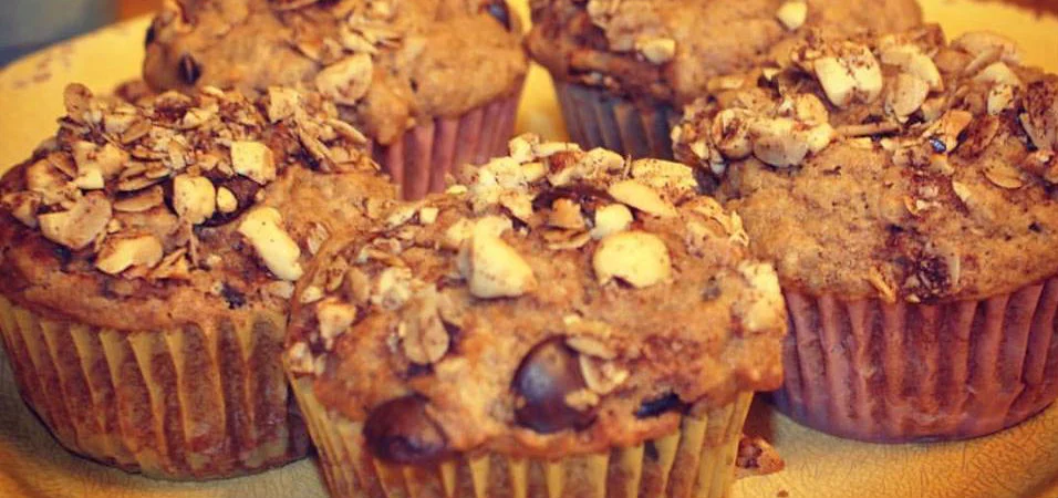Spiced Dark Chocolate Muffins Created by Caroline Bearden, MS, RD, LD Muffins have always been one of my favorite baked goods, and when I started pondering ways to highlight the infused green peanut oil and all of its spices, they seemed like the way to go. It took me three tries to get these babies right. And you may second guess the cayenne pepper or the red pepper flakes – in muffins, really? But trust me, it makes all the difference. The added spices help pull out the oil’s spices and give the muffins a little, unexpected kick. Plus, the streusel on top adds even more flavor and a crunch. Serve them warm at breakfast with some yogurt or milk, an afternoon snack, or even for dessert. 20 minutes 12 - Serving Size: 1 muffin Intermediate Ingredients For the muffins: 1 cup whole-wheat flour 1 cup all-purpose flour ¼ cup granulated sugar ¼ cup dark brown sugar ½ teaspoon salt ¼ teaspoon cayenne pepper 1 tsp cinnamon 3 light shakes of red pepper flakes 1 ½ teaspoons baking soda ½ cup old fashioned rolled oats ½ cup dark chocolate chips ¾ cup buttermilk ½ cup infused green peanut oil ½ cup unsweetened applesauce 1 large egg, lightly beaten 1 teaspoon vanilla For the streusel: 2 tablespoons infused green peanut oil ¼ cup chopped peanuts 2 tablespoons old fashioned rolled outs ½ teaspoon dark brown sugar 1 teaspoon cinnamon 1 shake of red pepper flakes Directions Preheat oven to 350. Spoon flour into a dry measuring cup and level with knife. Combine flour, sugar, baking soda, cayenne pepper, cinnamon, sea salt and red pepper flakes in a large bowl, stirring with a whisk, just until combined. Add in oats and dark chocolate and stir gently to combine. Make a well in the center of the mixture. In a small bowl, add the oil to the egg, then add the applesauce, milk and vanilla to combine. Add to the flour mixture, and stir just until moist. Spoon batter into 12 muffin cups coated with cooking spray. In another small bowl, make the streusel. Combine all ingredients and stir to combine. Top each muffin with a small spoonful of streusel. Bake for 20-25 minutes. Remove muffins from pans - place on a wire rack to cool. Store at room temperature in an airtight container or platic bag for up to a week or freeze for up to three months. Nutrition information per serving: Calories: 300 Calories from Fat: 150 Fat: 17g Trans fats: 0g Cholesterol: 15mg Carbohydrate: 34g Protein: 5g Fiber: 2g Sodium: 220mg