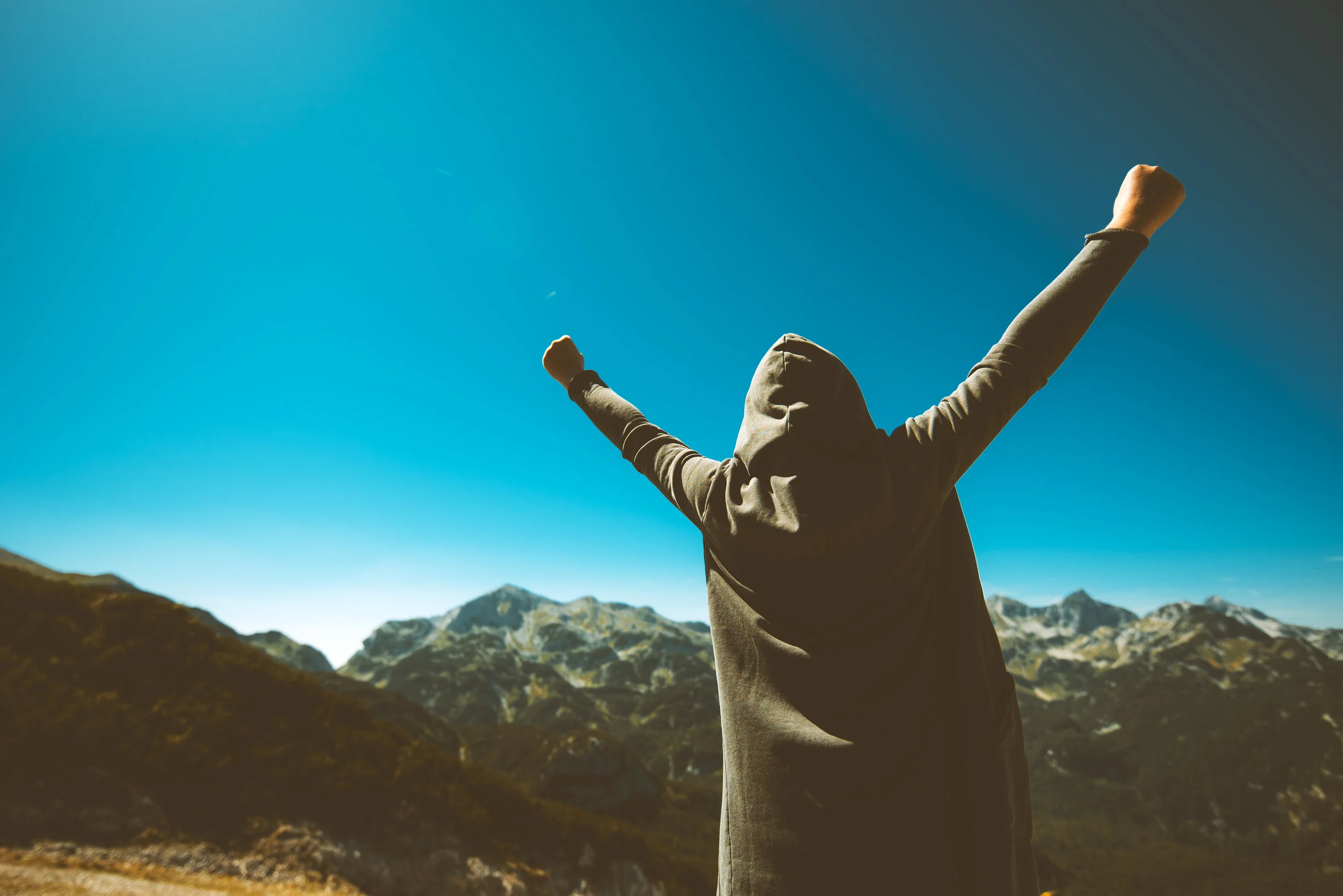 victorious-female-person-on-mountain-top-PX4LZRG.jpg