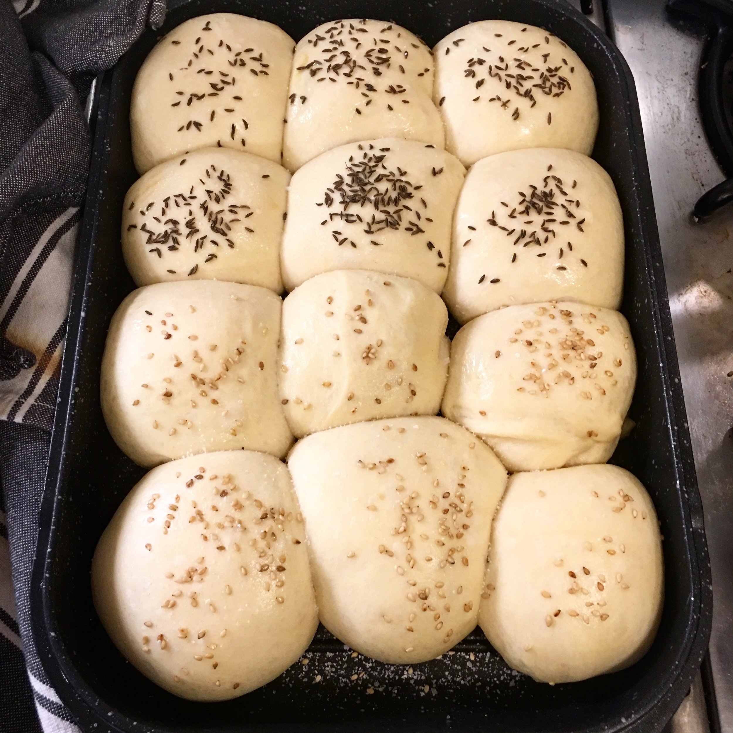 The top of our famous double-roaster is great for making bread. These buns, topped with sesame or caraway, are soft, smell great, and tear perfectly for dipping into the pesto or wiping the plate clean. Right? Who's with me? By the way, I hate the word "roll". It's a roll. But for deep, inexplicable-family-history-reasons, the word "roll" just doesn't appeal to me. And, "pass the rolls" feels funny to say. "Let's roll down the hill," on the other hand sounds great to me, and like a good idea. Wait, have I gone on too long about this? Eat the buns. With pesto. Or -- hey, a pesto butter! (Two parts pesto to one part softened butter, just mash it all together and store in the fridge.) Good for the rolls - uh, buns - and for dropping on vegetables, potatoes, steak.