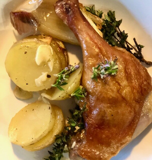 Duck Legs and thyme and garlic scented potatoes. A sumptuous but easy one pot wonder