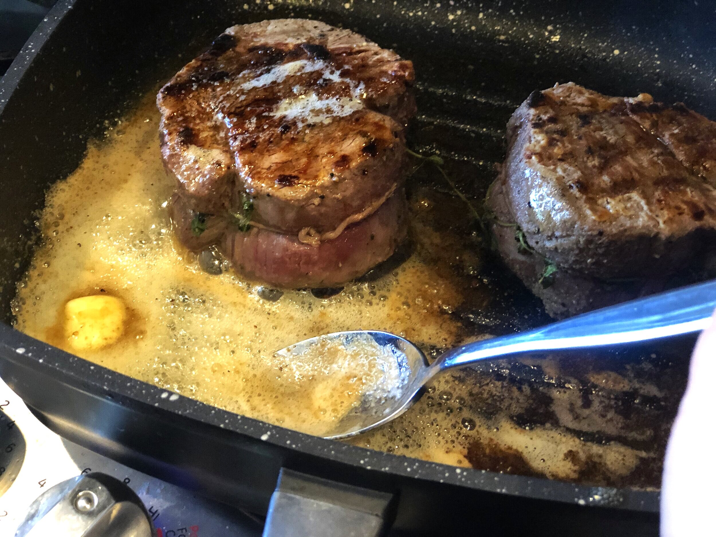 Butter basting in my EuroCAST grill pan. BergHOFF’s Folio line spoon does the work.