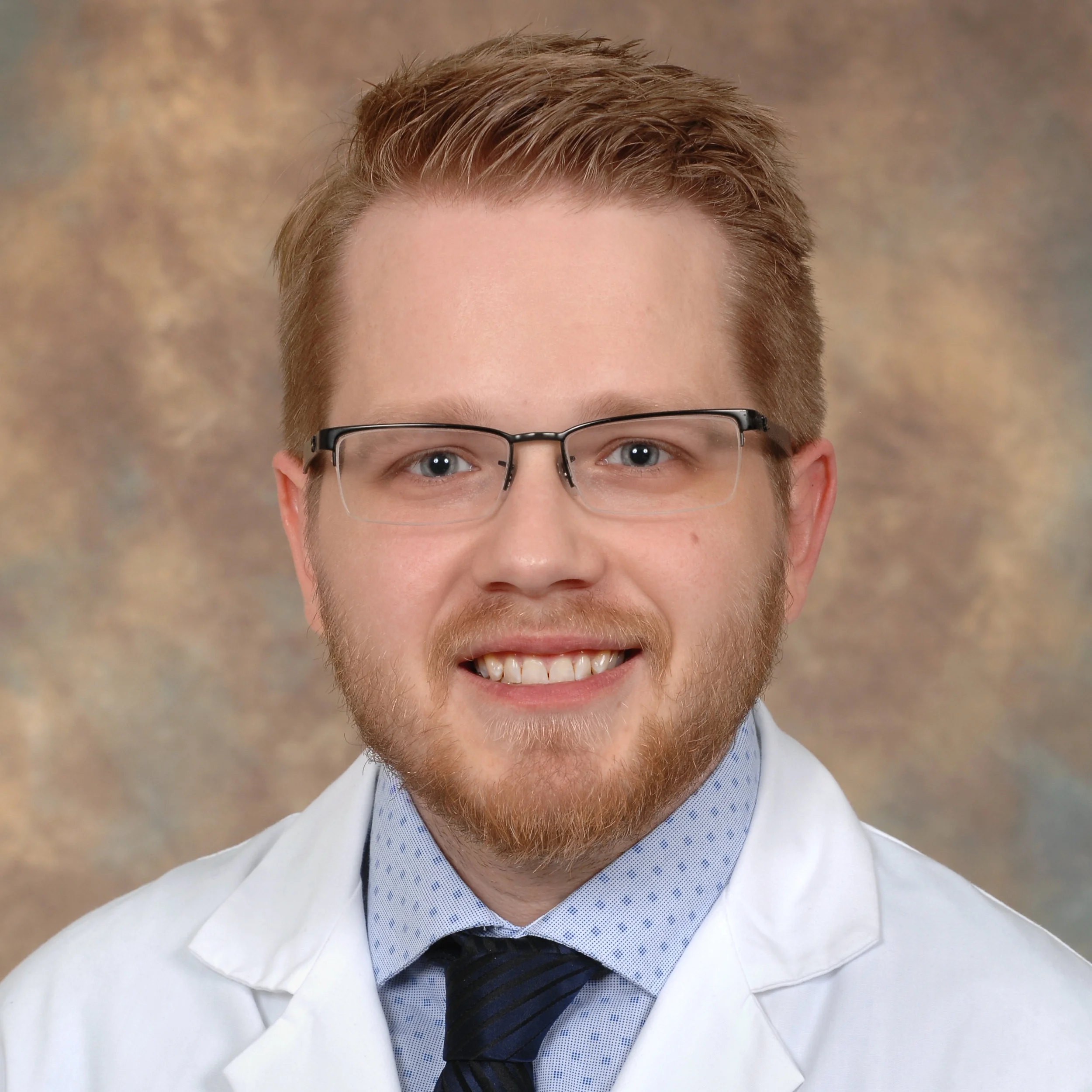 Corey Keeton - Marshall University SOM FMP- Corey Keeton finished his 5th year as one of the co-chiefs in Family Medicine and Psychiatry. He has now joined faculty with dual appointment in Family Medicine and Psychiatry. He is working in diverse environments including: Inpatient Consult-liaison Psychiatry, Outpatient neurodevelopment psychiatry, collaborative care and inpatient family medicine. One of his many passions includes residency education and building curriculum. Residency bio: I am from Ashland, KY and attended school at Marshall. I entered medical school with a strong interest in psychiatry, but quickly fell in love with primary care. The FMP program gives me a unique skill set that prepares me to practice comprehensive medicine in underserved populations. I also have a strong interest in teaching and plan to incorporate clinical education into my future career. Outside of the hospital, I enjoy spending time with friends and family. Rachel and I also read lots of YA novels.