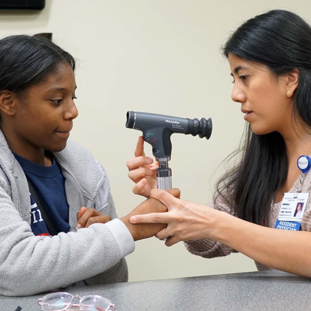  Dr. Jaramillo teaches on how to look at the optic nerve. That girl has the nest physical exam I have ever seen.  