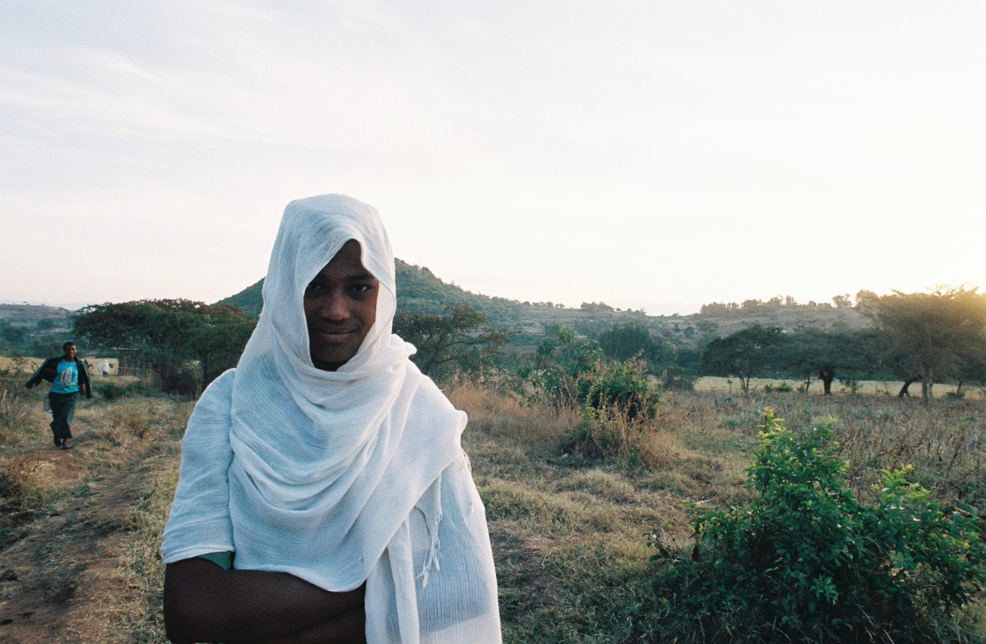  A young Ethiopian girl walking at dawn to school in the egalitarian community of Awra Amba. Founded in 1980 by Zumra Nuru, the community is home to over 450 residents and promotes gender equality. It remains controversial within religious communitie