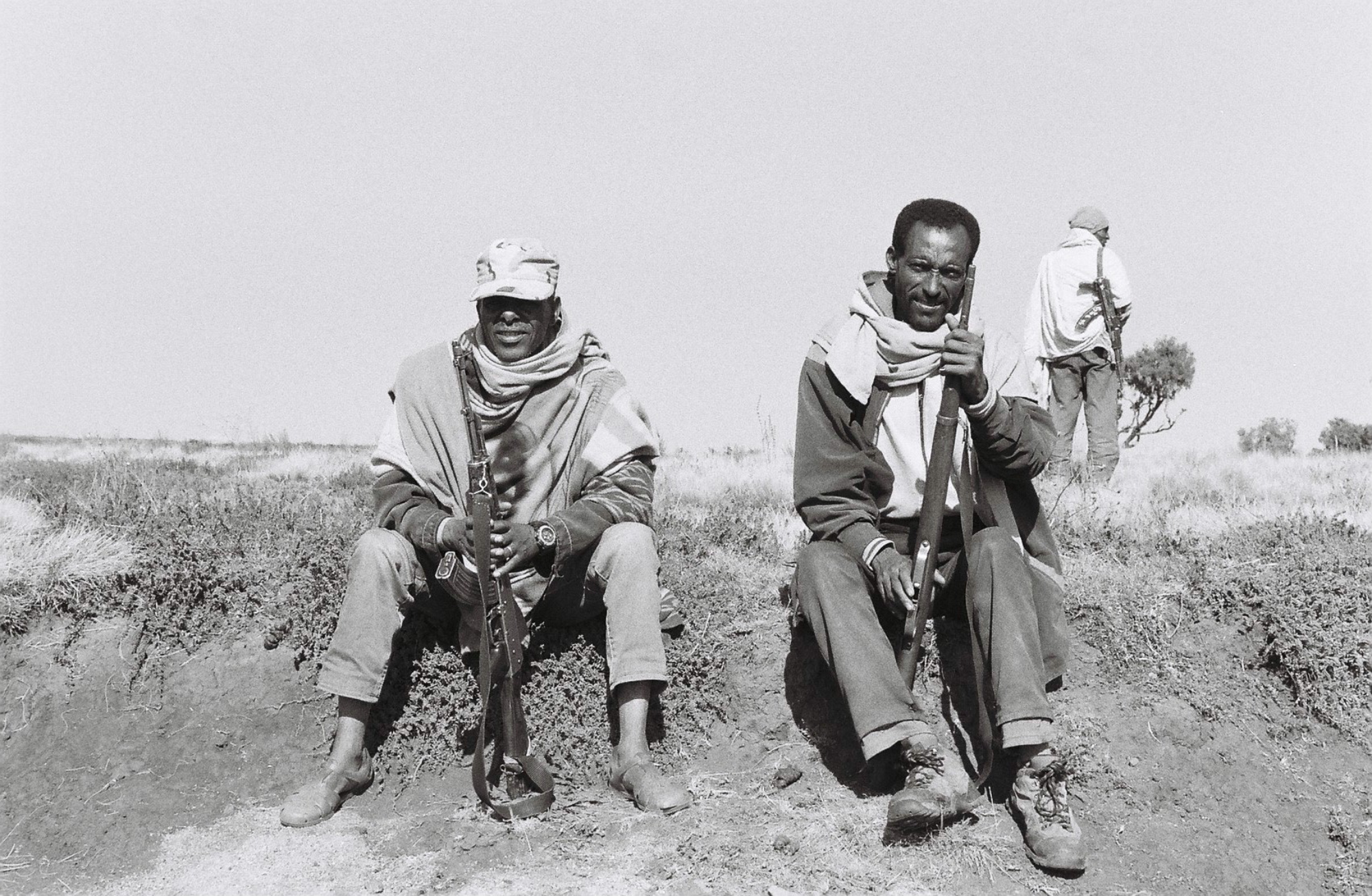  Scouts watch over tourists exploring the Simien Mountains. They are local men who pick up work from tour guides operating out of Debark. They carry Kalishnakov's and sleep on the ground outside tourist tents, often huddle together by a small fire.&n