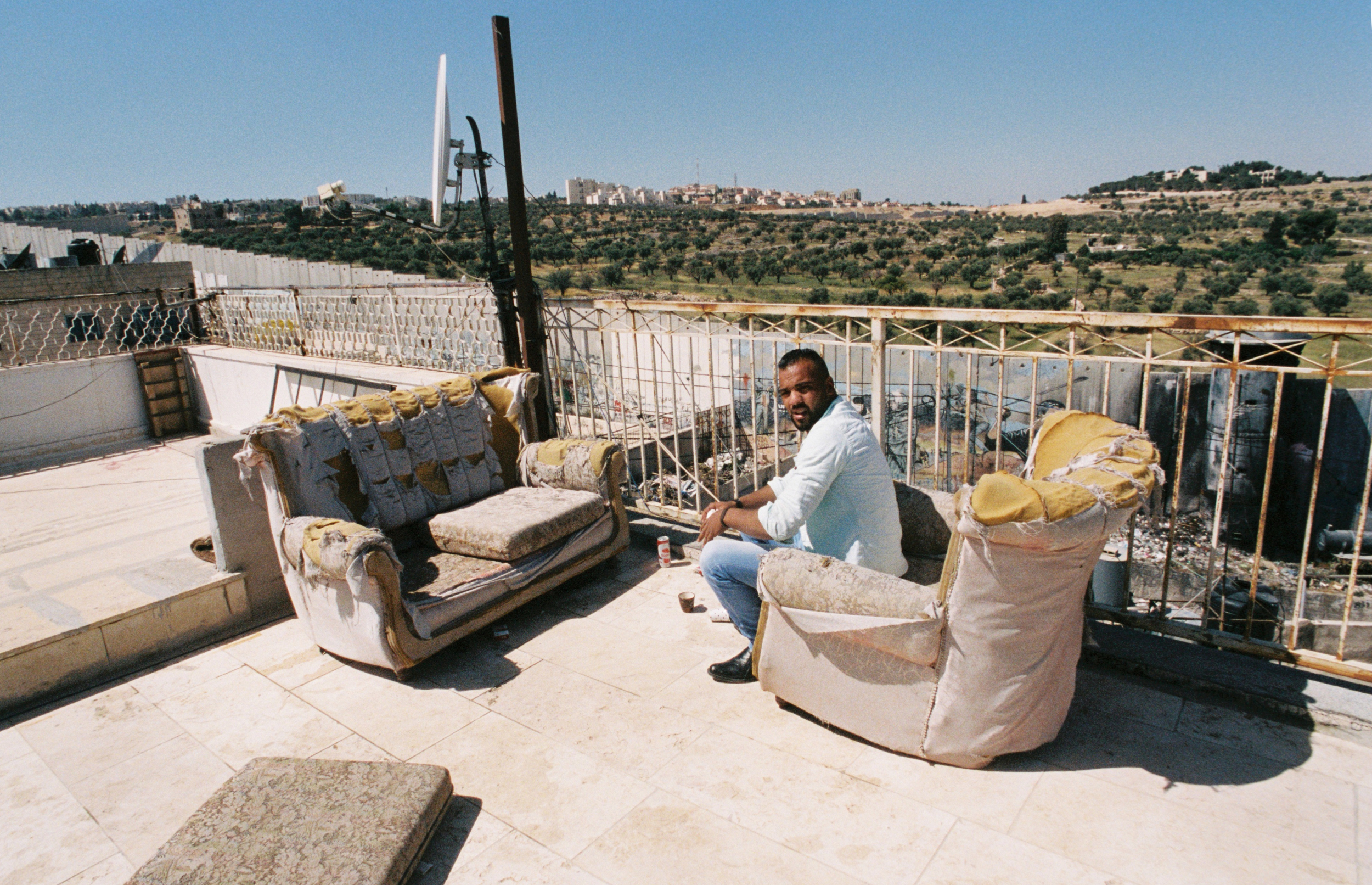 Haleen, 25, was released 8 days ago from a 3-year prison sentence. A Palestinian refugee he lives in the Aida camp situated 2 kilometers north of the historic center of Bethlehem. Sitting on the rooftop of his apartment building, he shares stories from his time in prison and details about his family history while looking below at the wall that separates Israel from the West Bank. "We are not terrorists," he says. "We are fighting for our rights." - April 29, 2017
