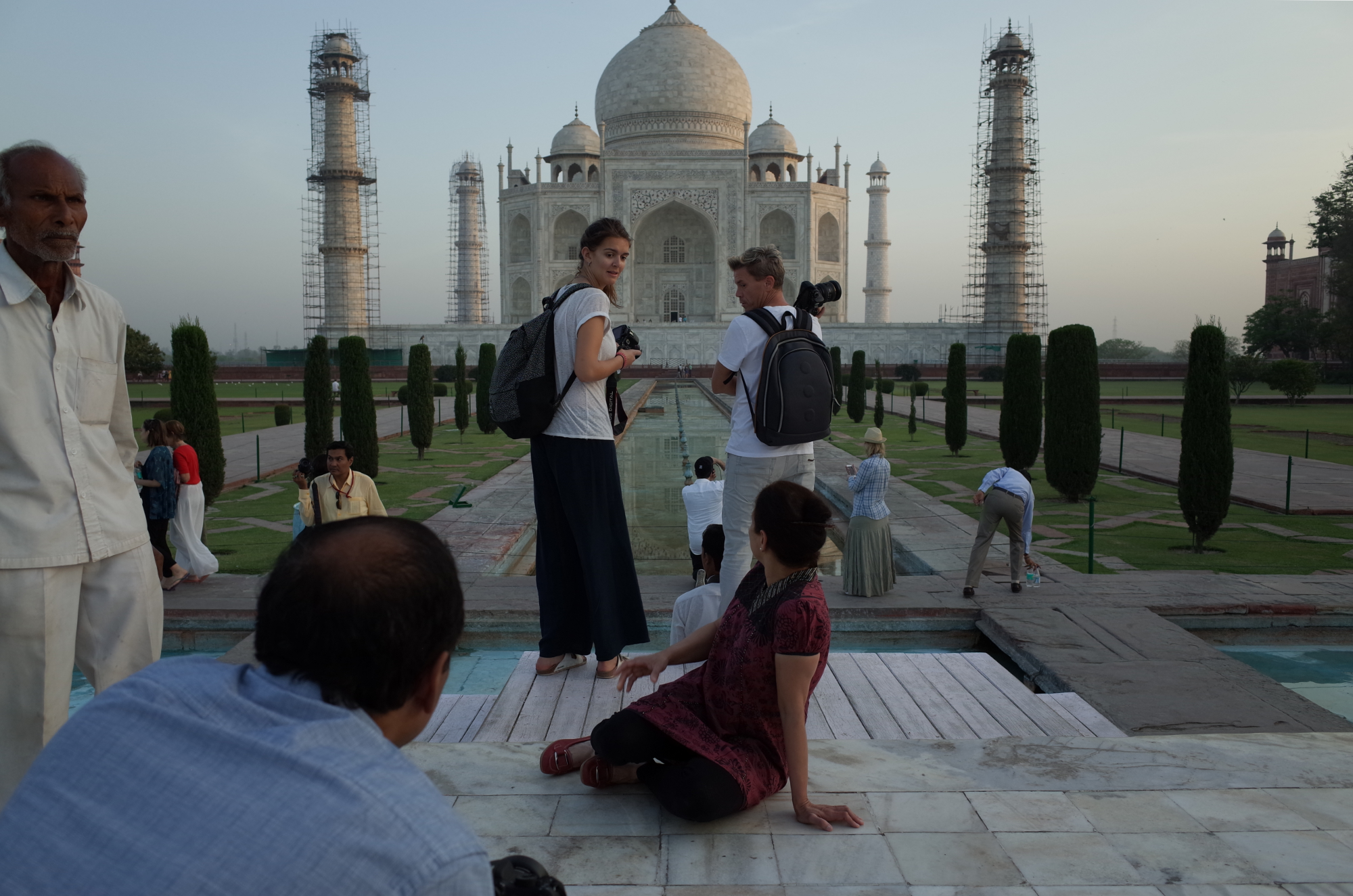 Exchanging frustrated glances, tourists hustle for the best spot to photograph the Taj Mahal at sunrise. Photo By: Sarah Tesla