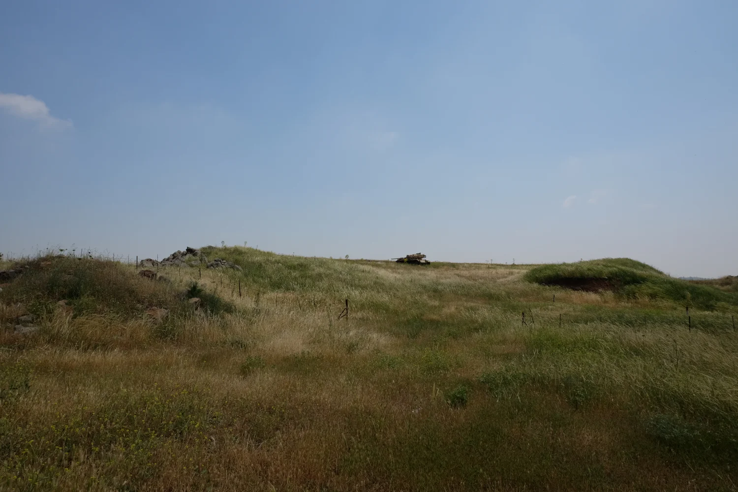 An abaondoned tank, likely Israeli points it's turret towards Syria from a farmers field in Golan Heights. Photo By: Sarah Tesla