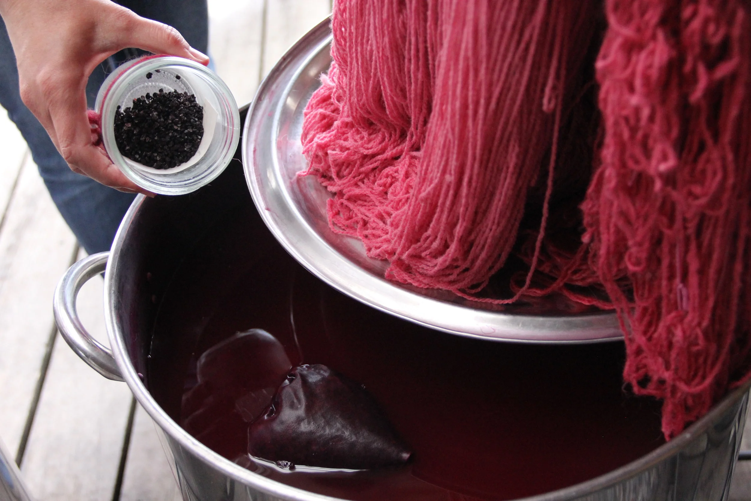 Freshly dyed yarn, straight out of a cochineal bath in our Natural Dyeing area