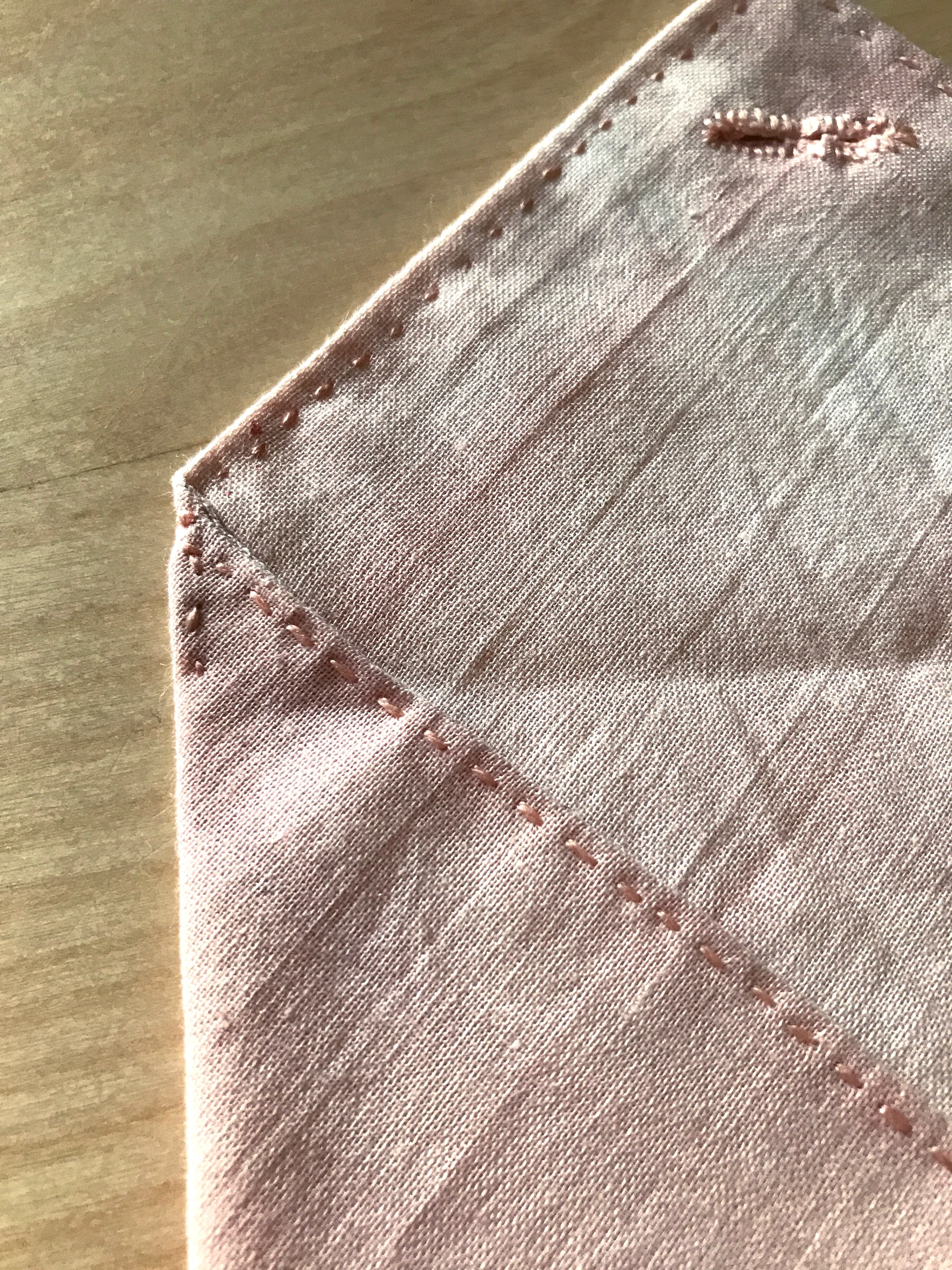 46. Tack side flaps down with a just a few stitches between the top fold and the end of the flaps.