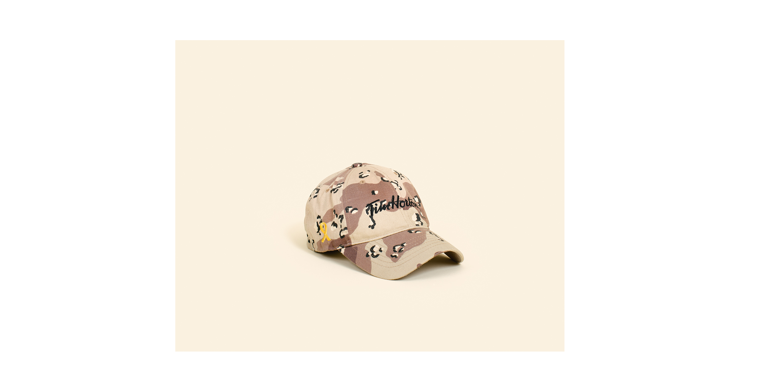  Tim Hortons camouflage cap - a highly coveted souvenir by soldiers and contractors serving at Kandahar Airfield.&nbsp;  Since opening in Kandahar Airfield in 2006, the popular Canadian coffee shop Tim Hortons has served four million cups of coffee, 