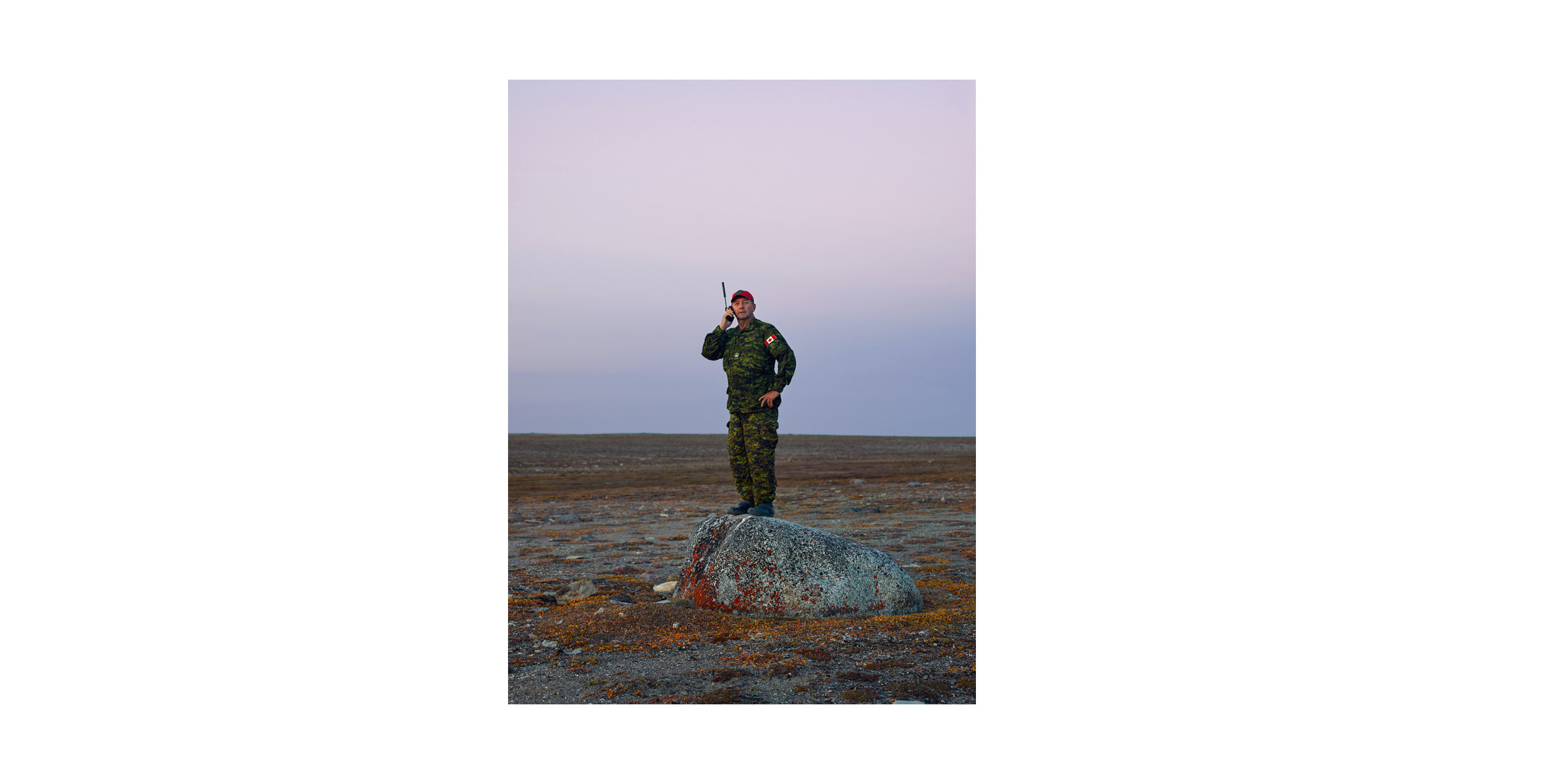  Ranger instructor Warrant Officer Woody Keeping uses a satellite phone to maintain contact with headquarters in Yellowknife. 