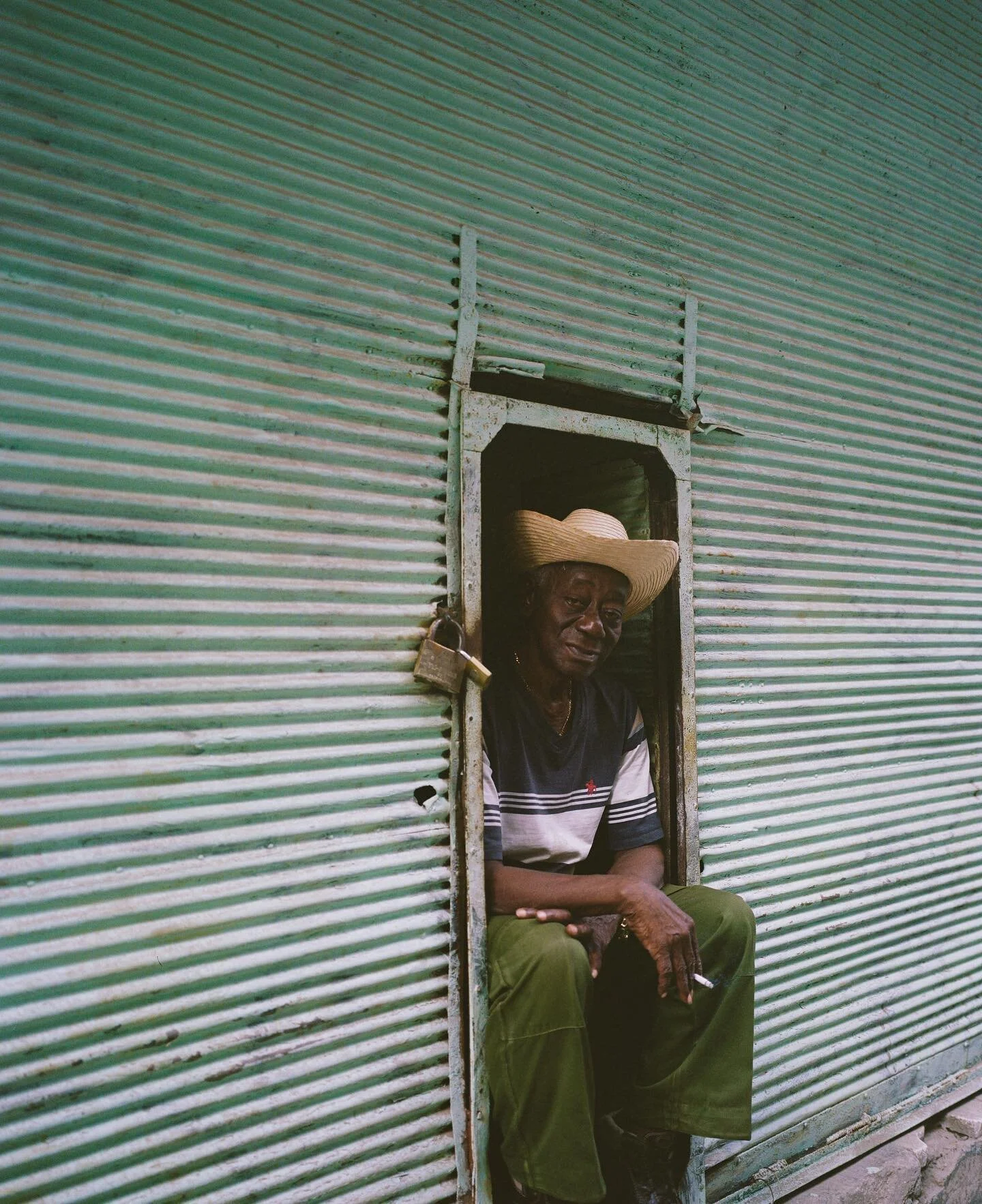 i remember this moment vividly. his eyes were gentle and he was sitting there smoking his cigarette, people watching. my heart skipped after he let me photograph him.