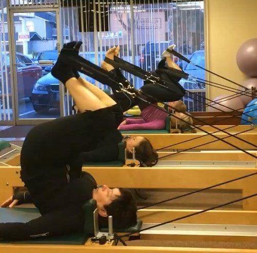✨ #ThrowbackThursday ✨
This pic takes it back about ten years to this moment of focus and strength! Here are four of our amazing students practicing Short Spine Massage on the reformer&mdash;a classic Pilates exercise that gives an incredible back ma