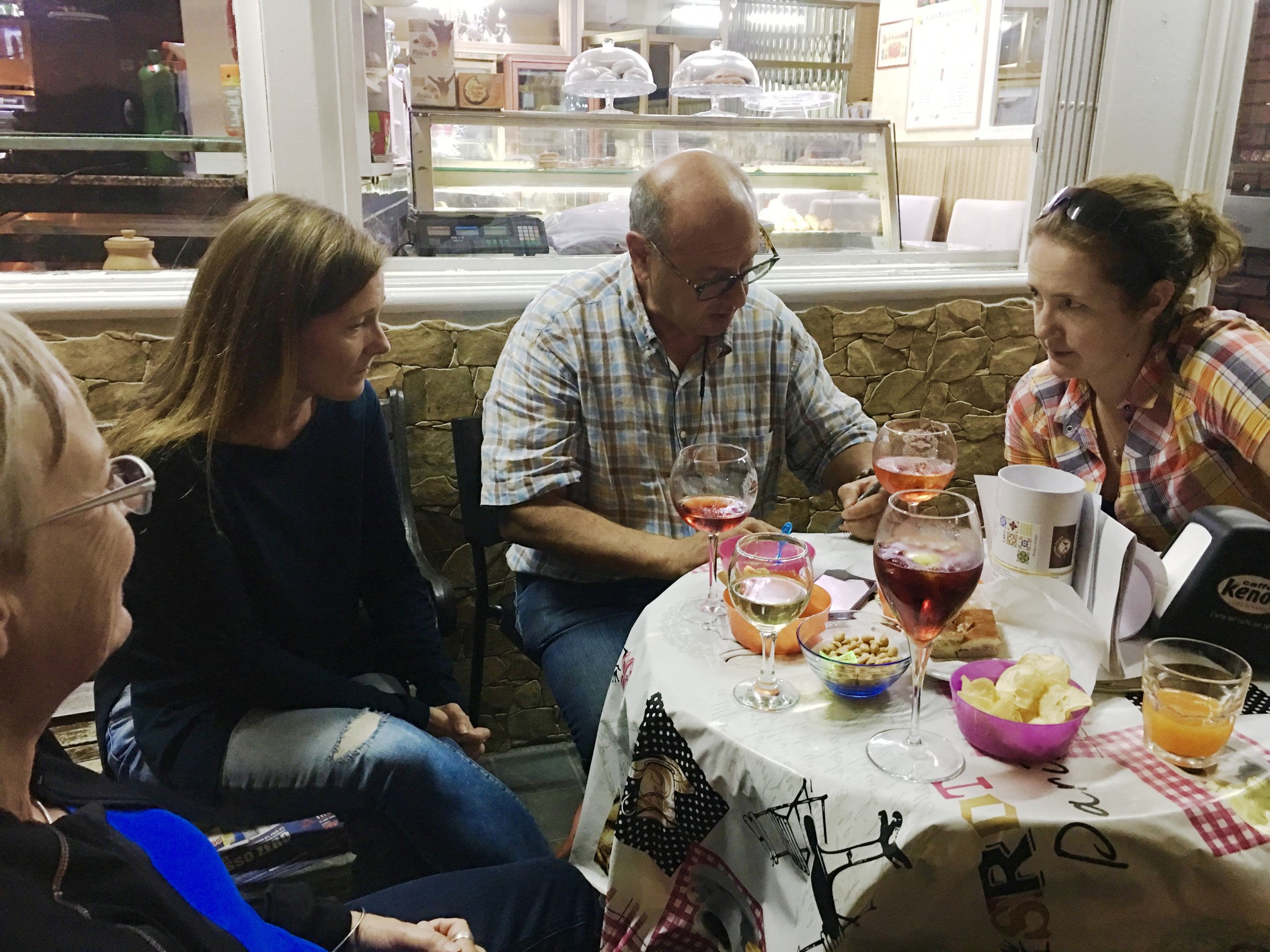 In Graniti, the group met regularlyat Franco's bar and gas station for aperitivos and cappuccinos. Here accommodation plans are being sorted with Salvatore.